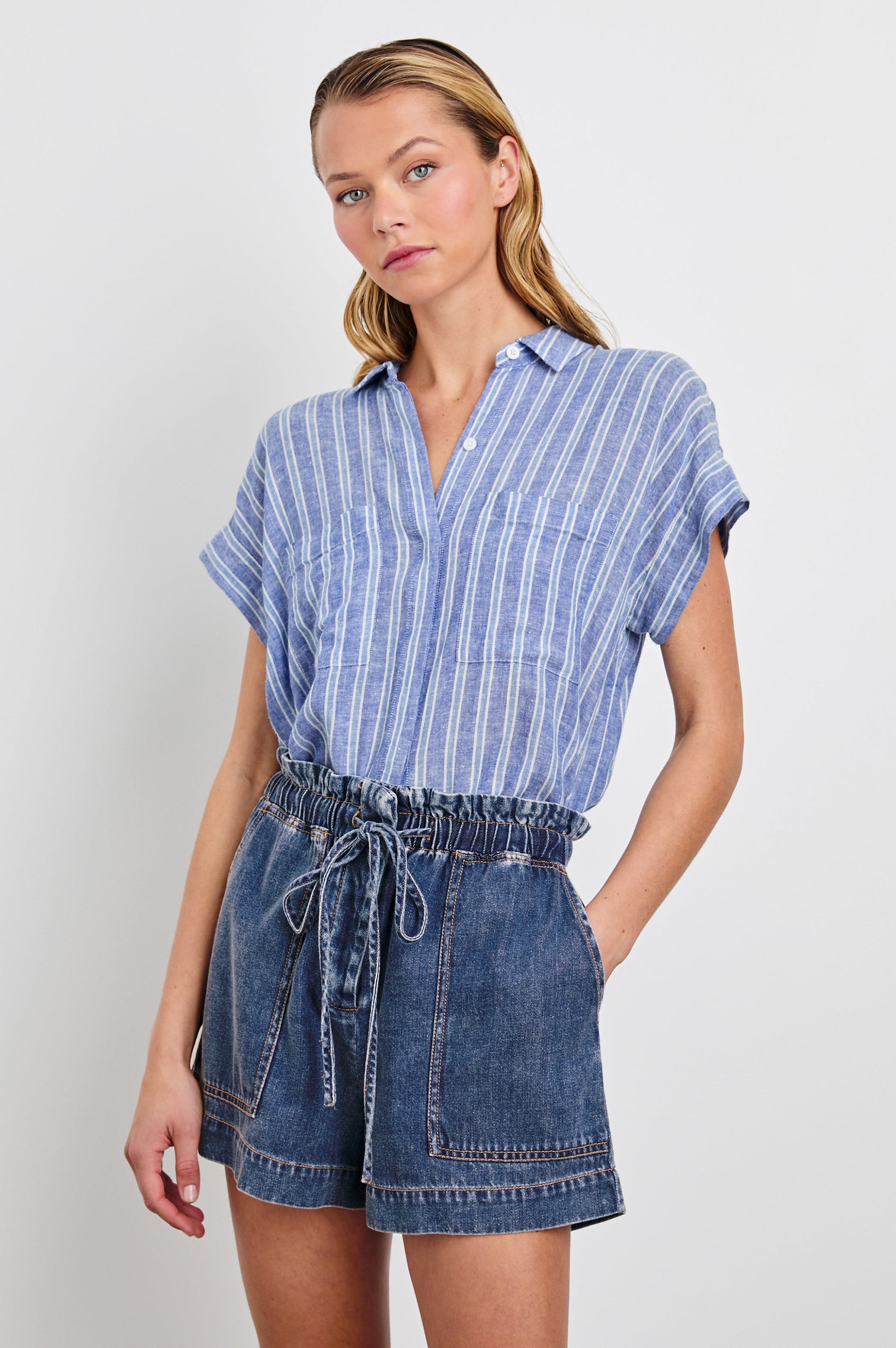 Cito Short-Sleeve Button Down with two Chest Patch Pockets in Lake View Stripe Colorway, Vertical Stripes in Blues and White - Front Tucked View Featured on Model