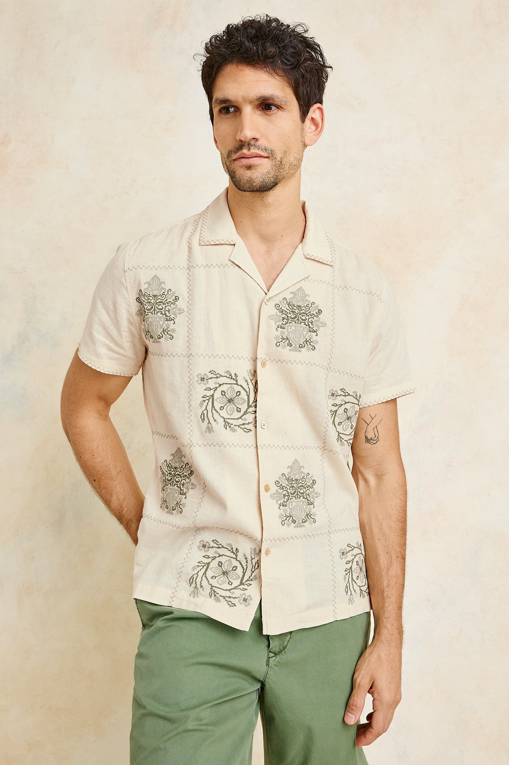 Clairo Button Front Shirt with a Relaxed Lapel, Cuffed Short Sleeves and Embroidery throughout in Cream Quilt Squares Colorway. Front View Shown on Model.