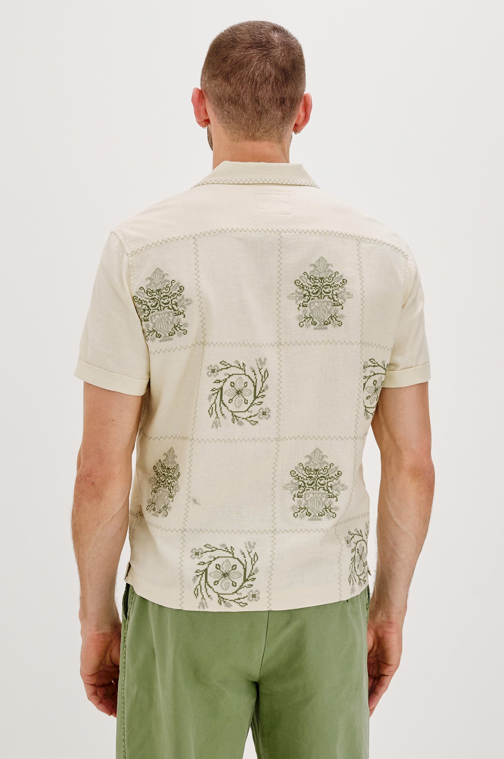 Clairo Button Front Shirt with a Relaxed Lapel, Cuffed Short Sleeves and Embroidery throughout in Cream Quilt Squares Colorway. Back View Shown on Model.