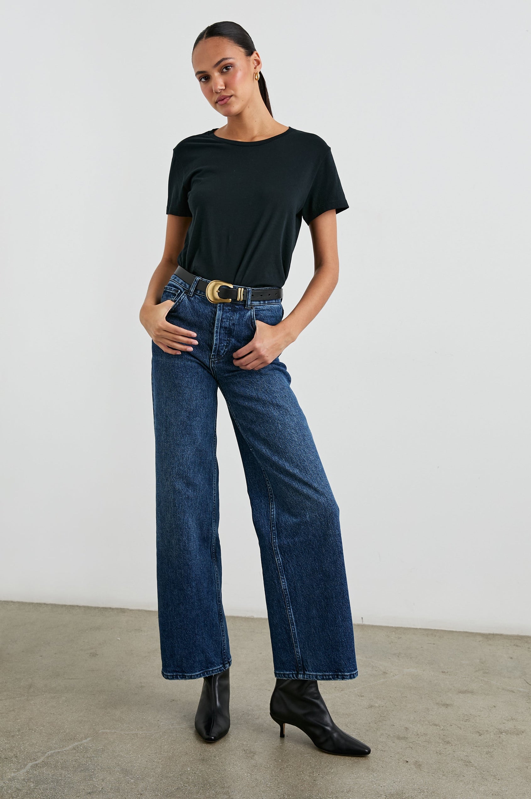 Classic Short Sleeve Crew Neck T-Shirt in Black Colorway - Front Tucked Full Body View Featured on Model