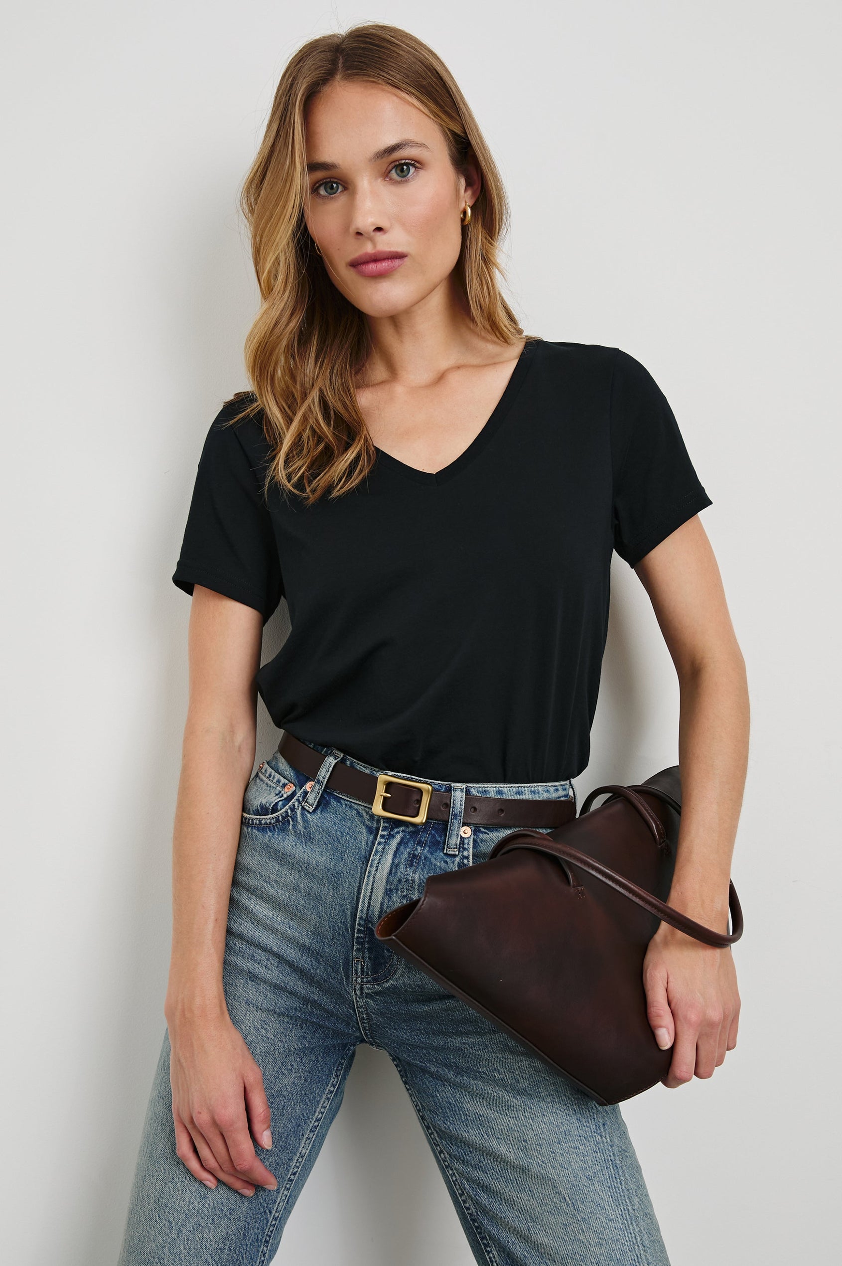 Classic Short Sleeve V Neck T-Shirt in Black Colorway - Front Tucked View Featured on Model