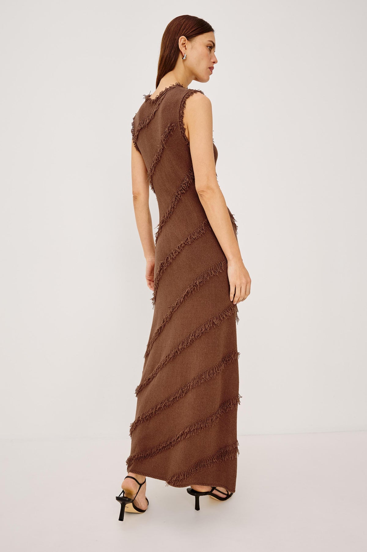 Claudia Maxi Dress in Silk Blend With Diagonal Fringe Trim, Round Neckline, and Straight Hem in Cinnamon Colorway - Full Body Back View Featured on Model