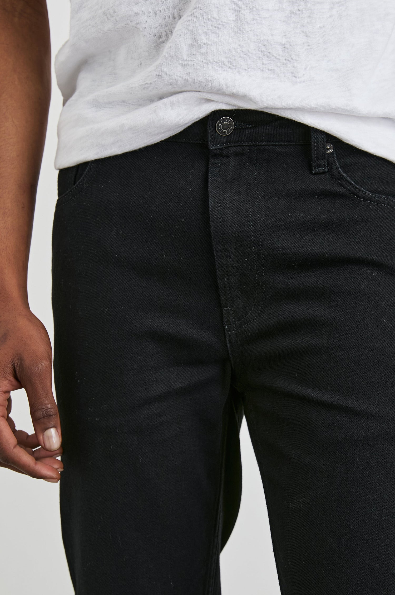 Clayton Slim Straight Jeans with Belt Loops, Two Front Pockets plus a Coin Pocket and Two Back Patch Pockets in Dark Black Colorway - Front View Featured on Model