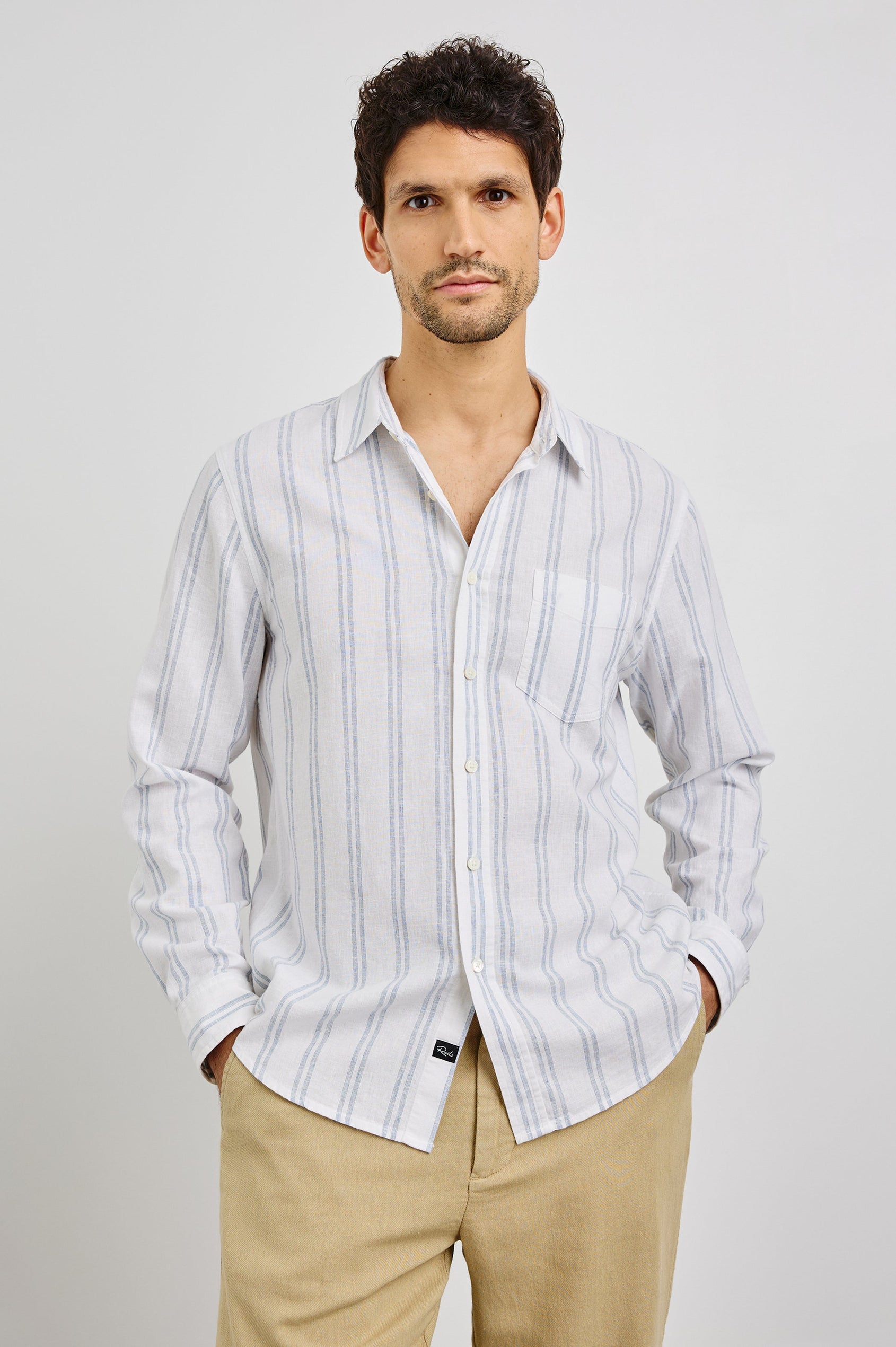 Clyde Collared Button Front Shirt with Long Sleeves and a Chest Pocket in White Azure Colorway. Front View Shown on Model.