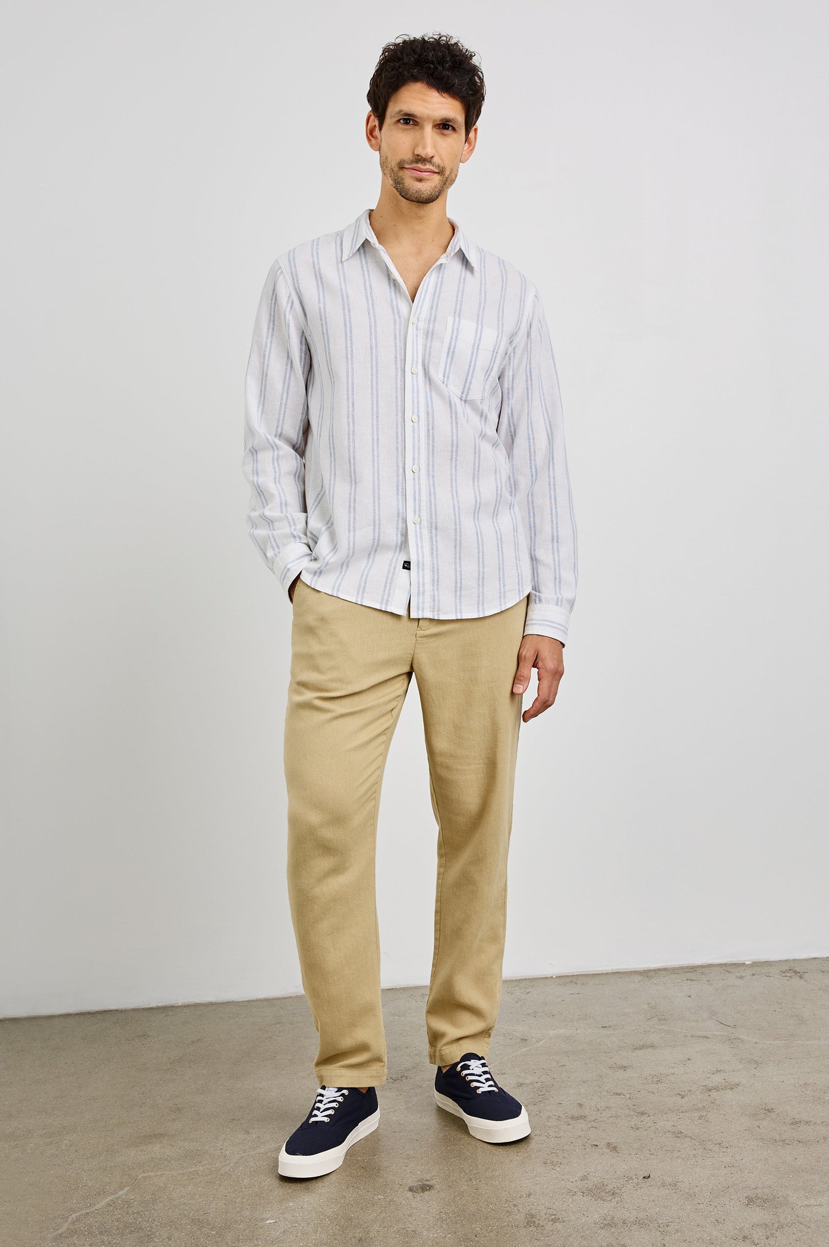 Clyde Collared Button Front Shirt with Long Sleeves and a Chest Pocket in White Azure Colorway. Front View Shown on Model.