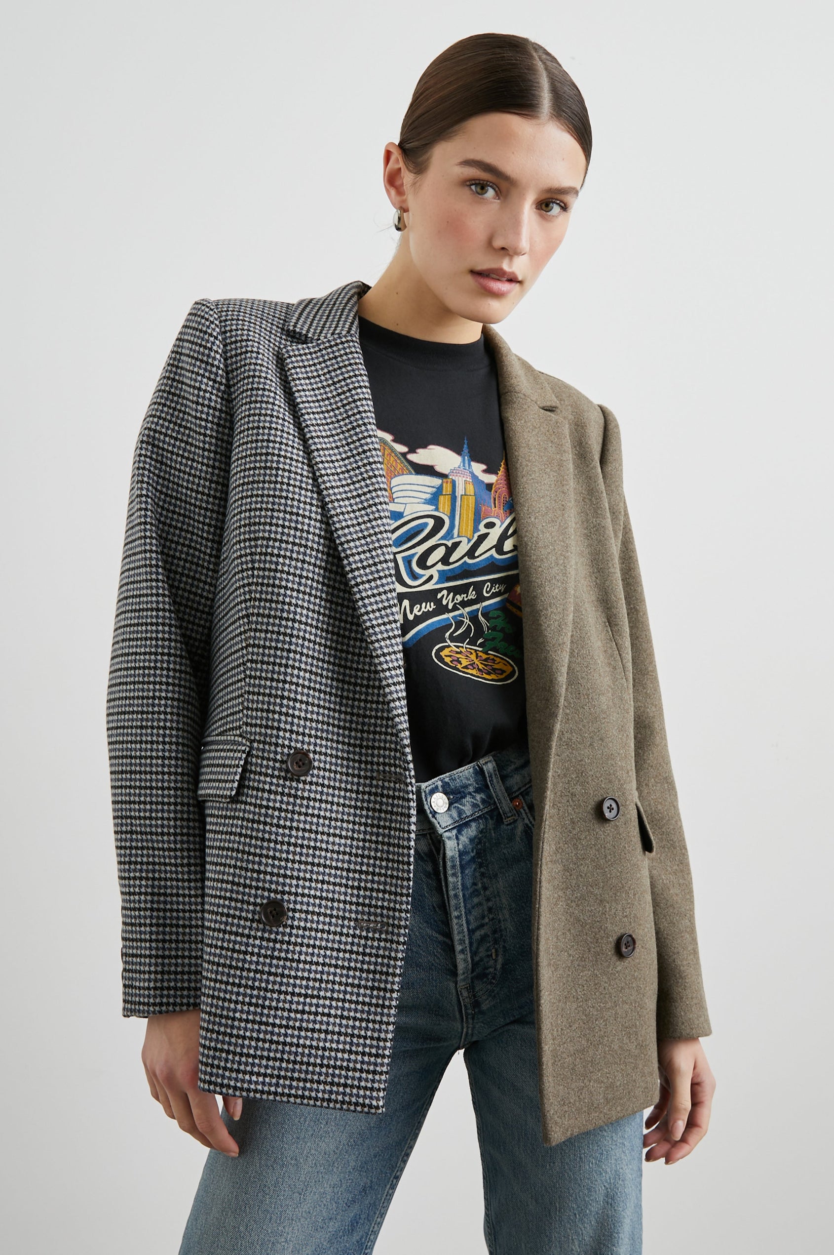 Cody Double-Breasted Blazer with Two Button Closure, Two Front Flap Pockets, and Four-Button Cuffs in Mixed Mini Check Colorway, the Right Half is Houndstooth in Blue and Black, the left half is Brown - Front View Featured on Model