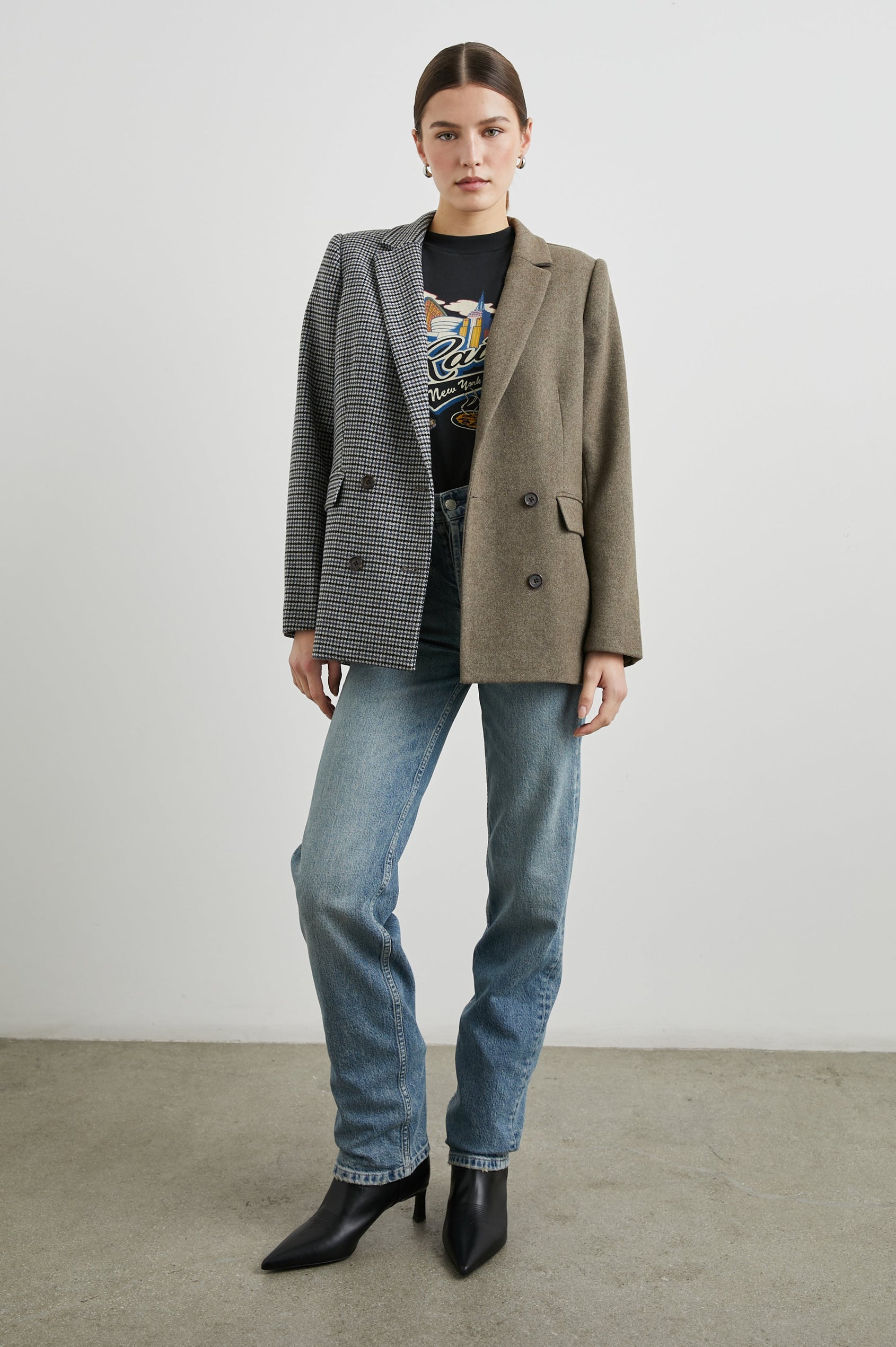 Cody Double-Breasted Blazer with Two Button Closure, Two Front Flap Pockets, and Four-Button Cuffs in Mixed Mini Check Colorway, the Right Half is Houndstooth in Blue and Black, the left half is Brown - Front Full Body View Featured on Model