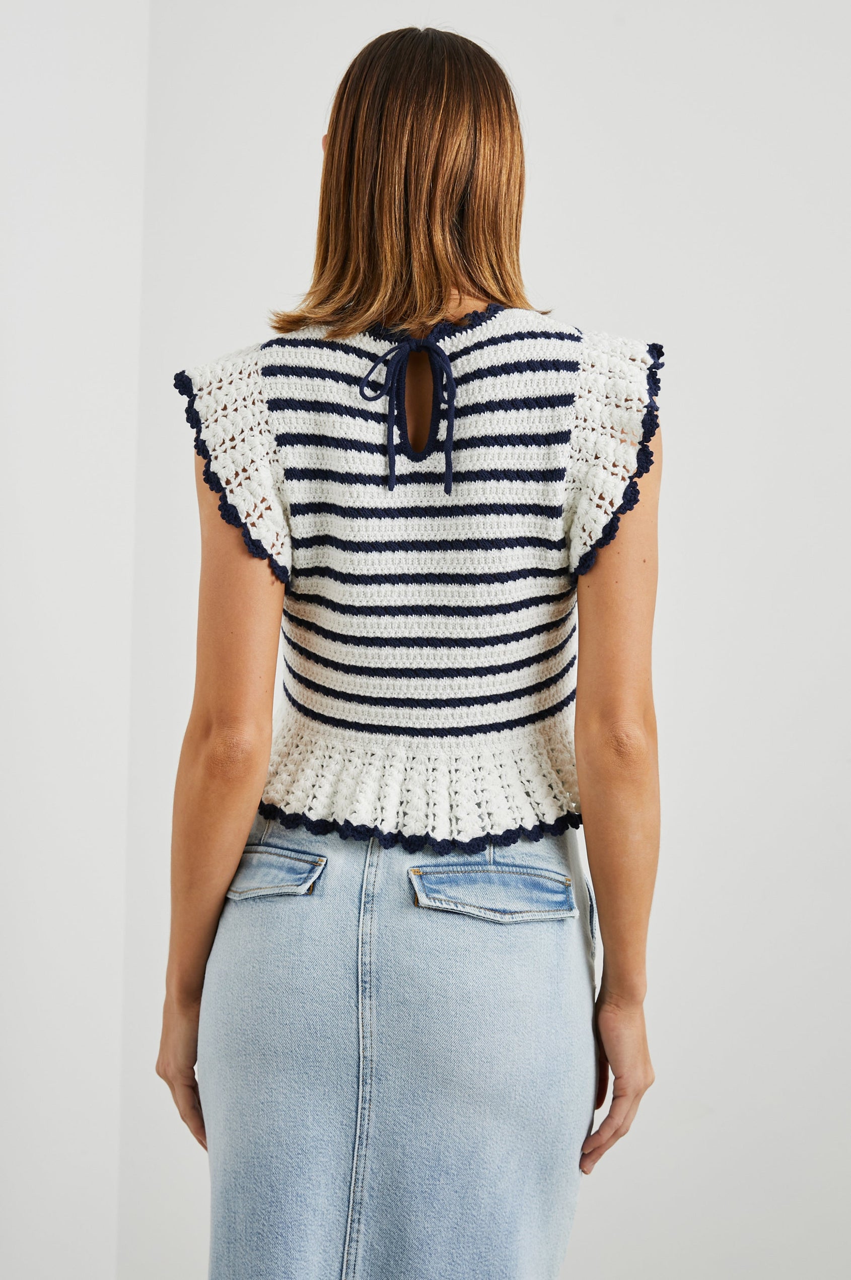 Coen Crochet Knit Short-Sleeve Top with Flared Sleeves and a Back Keyhole Tie in Anadia Stripe Colorway, with Navy and White Horizontal stripes - Back View Featured on Model
