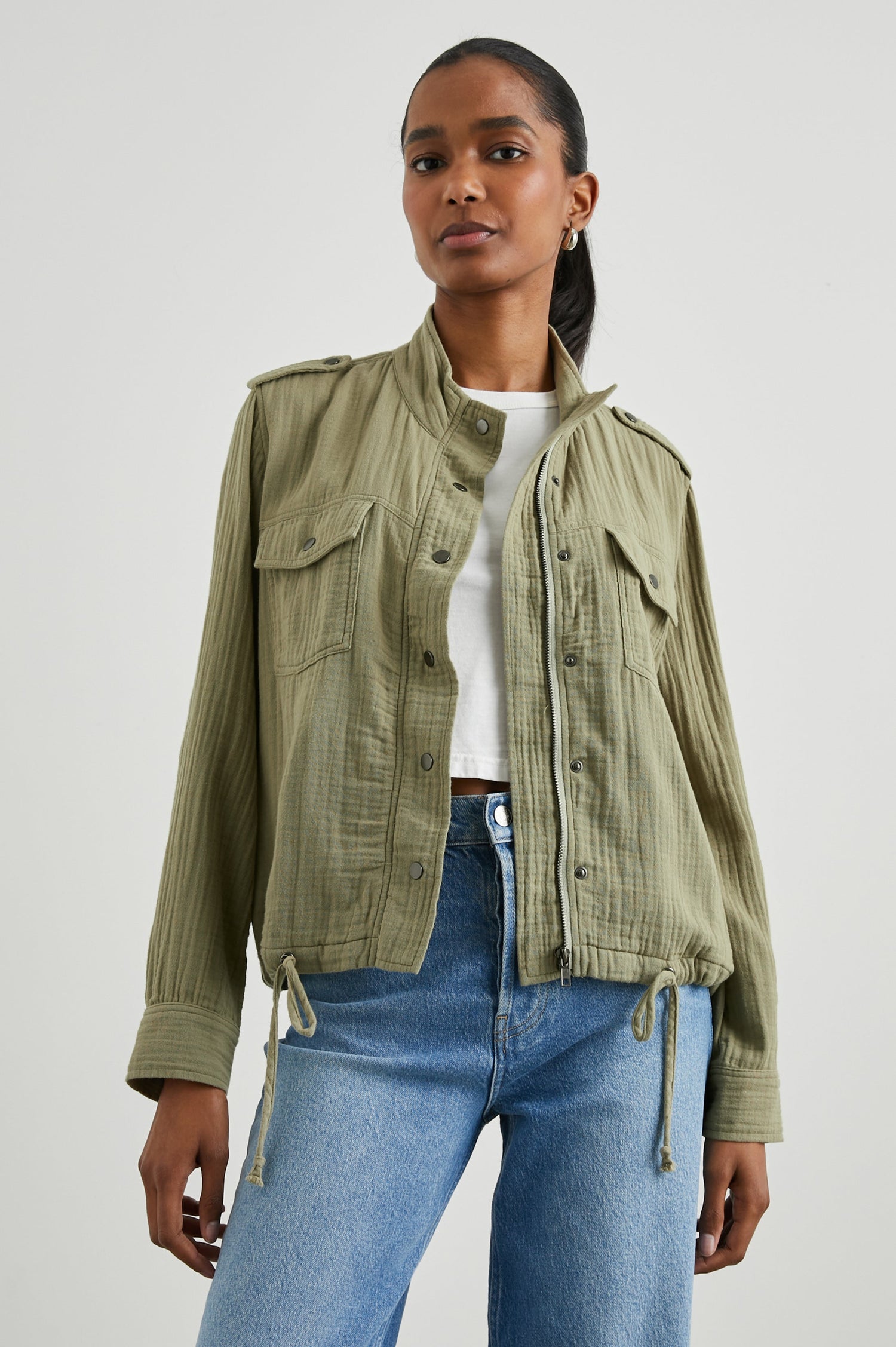 Collins Jacket with Zip and Snap Closure, Two Chest Snap Flap Pockets, Toggle Drawstring Hem, Snap Shoulder Straps and a Breathable Back Flap in Gauze Mermaid Colorway - Front View Featured on Model