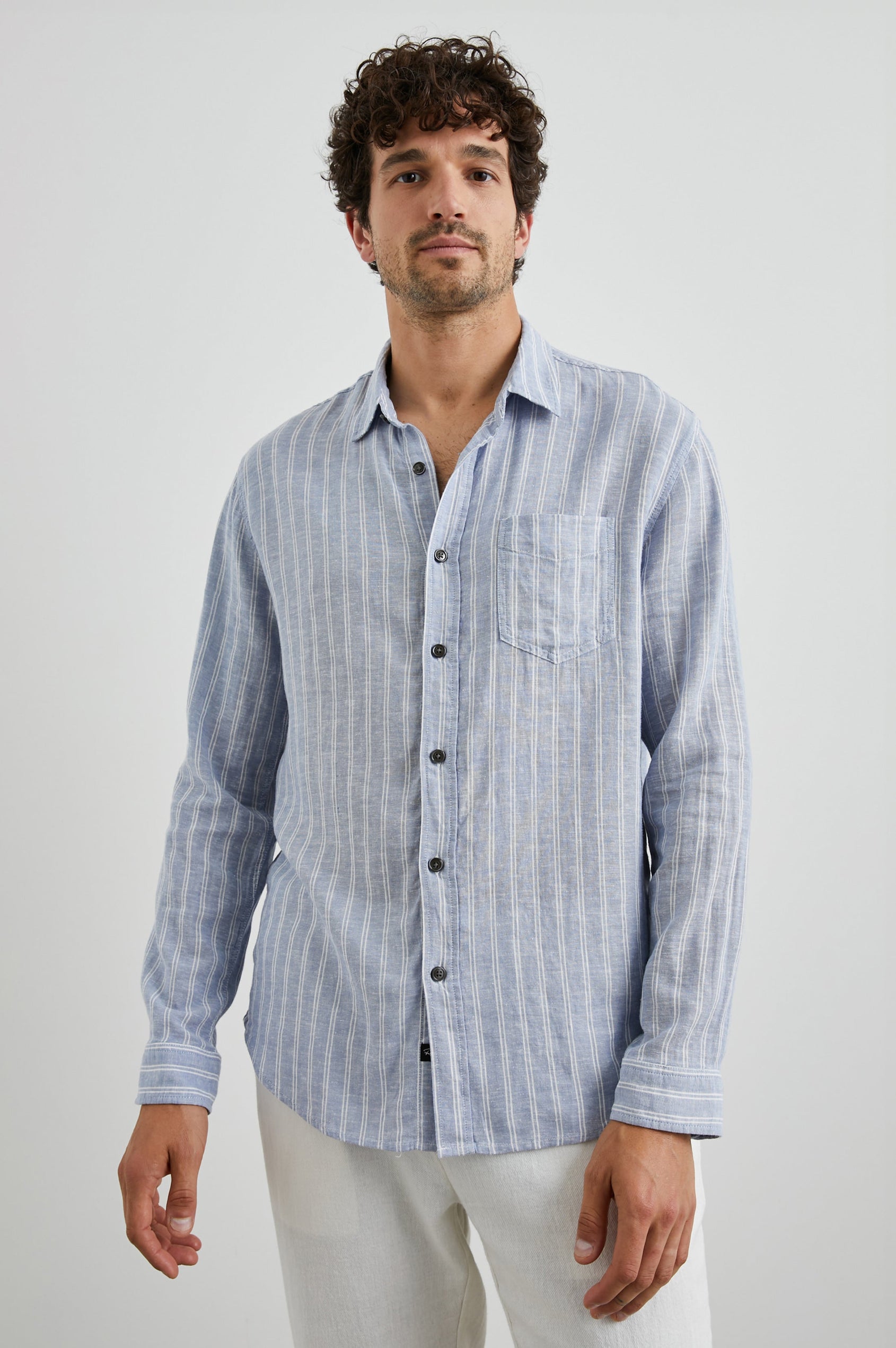 Connor Long-Sleeve Button Up with a Chest Patch Pocket in Denim White Pinstripe Colorway - Front View Featured on Model