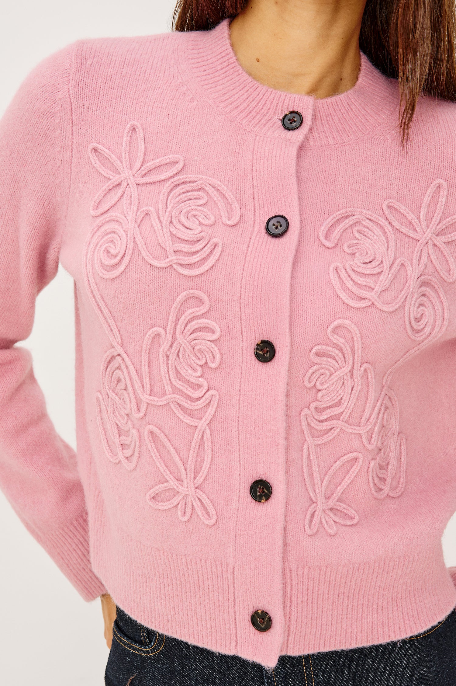 Coralee Cardigan in Alpaca Knit With Soutache Rosette Front Detailing, a Crew Neckline, Front Buttons, Ribbed Trim, and Long Sleeves in Ballet Colorway - Upper Body Close Up View Featured on Model