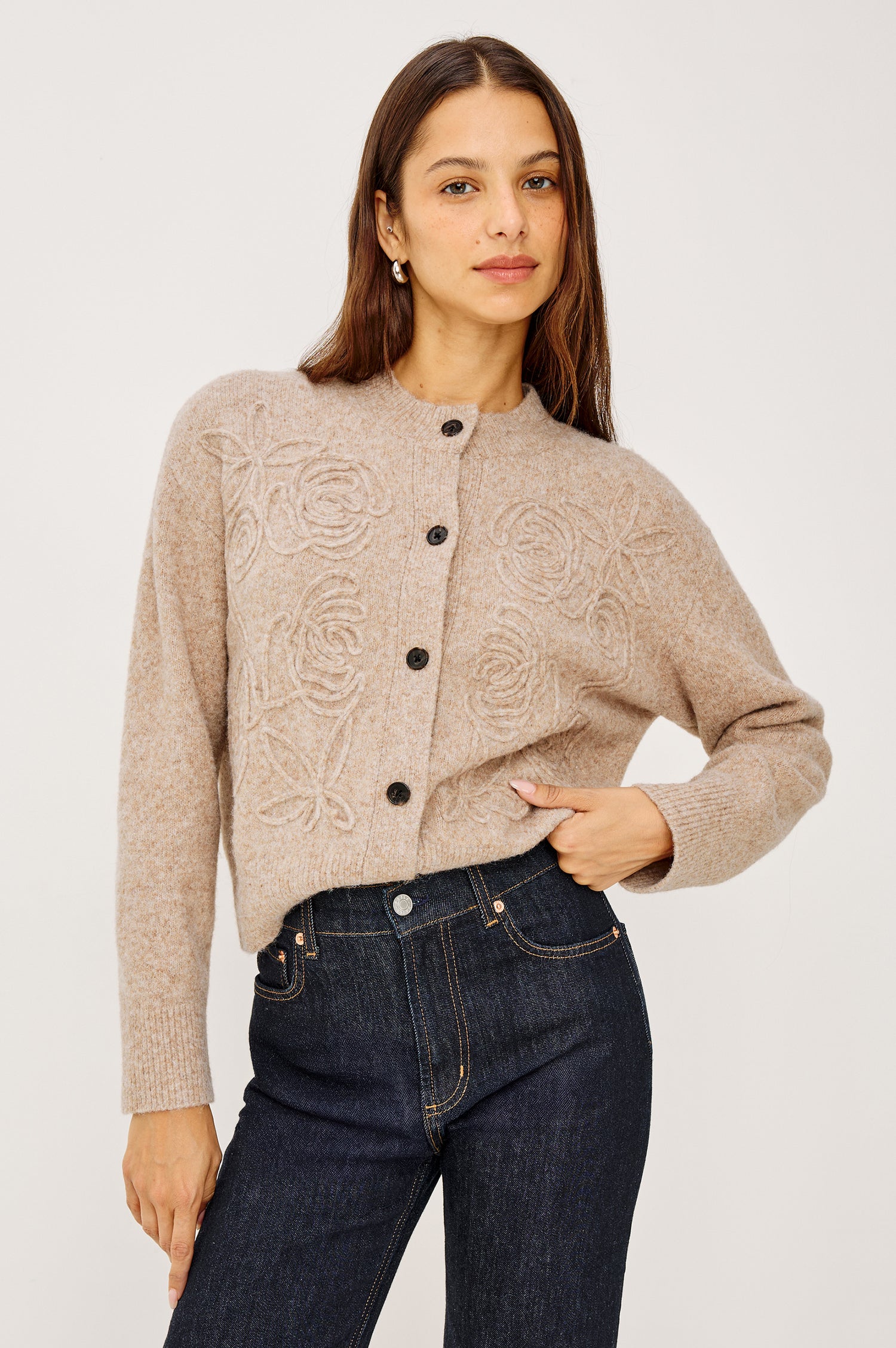 Coralee Cardigan in Alpaca Knit With Soutache Rosette Front Detailing, a Crew Neckline, Front Buttons, Ribbed Trim, and Long Sleeves in Sand Colorway - Upper Body Front View Featured on Model