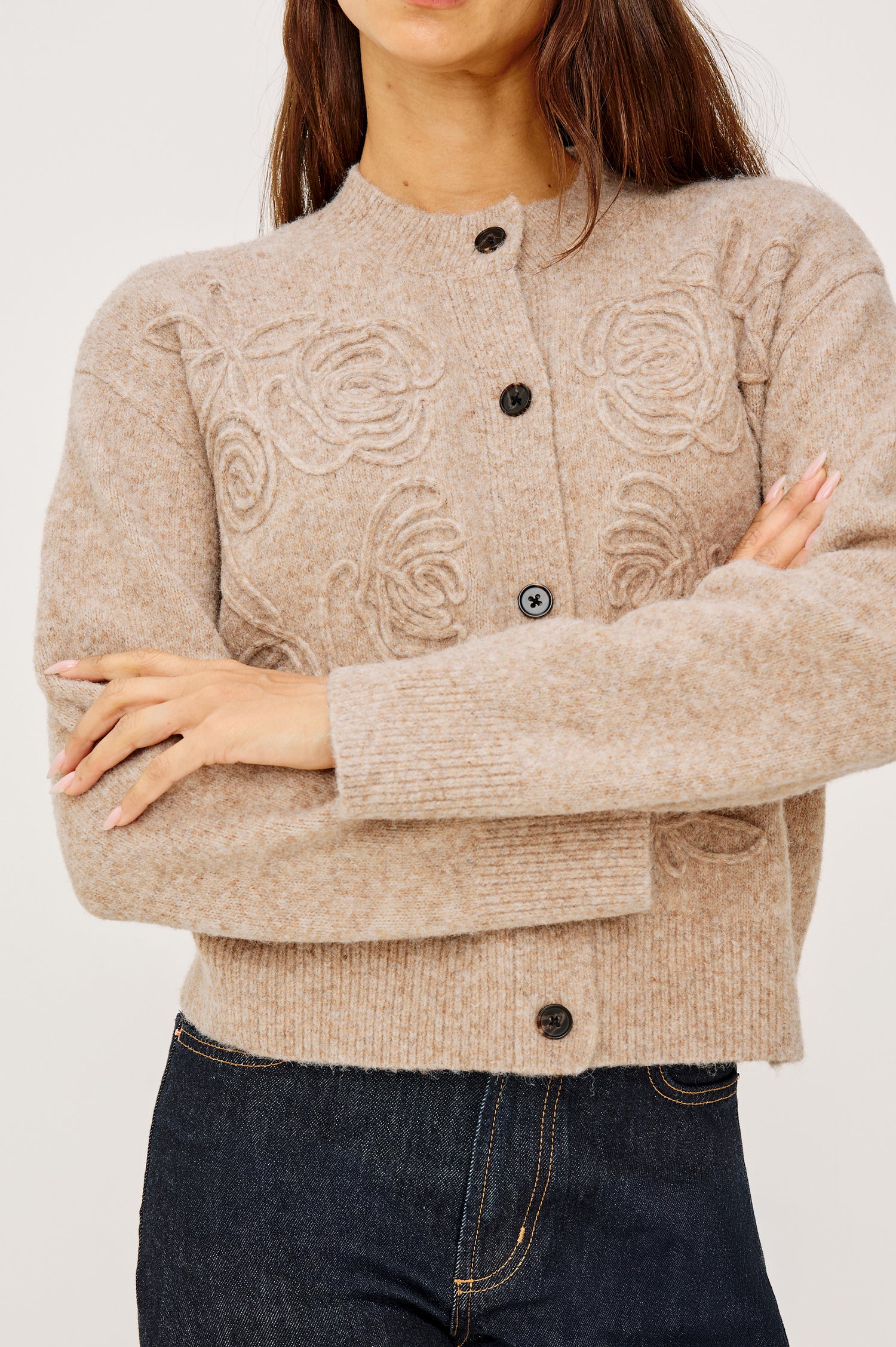 Coralee Cardigan in Alpaca Knit With Soutache Rosette Front Detailing, a Crew Neckline, Front Buttons, Ribbed Trim, and Long Sleeves in Sand Colorway - Upper Body Close Up Front View Featured on Model