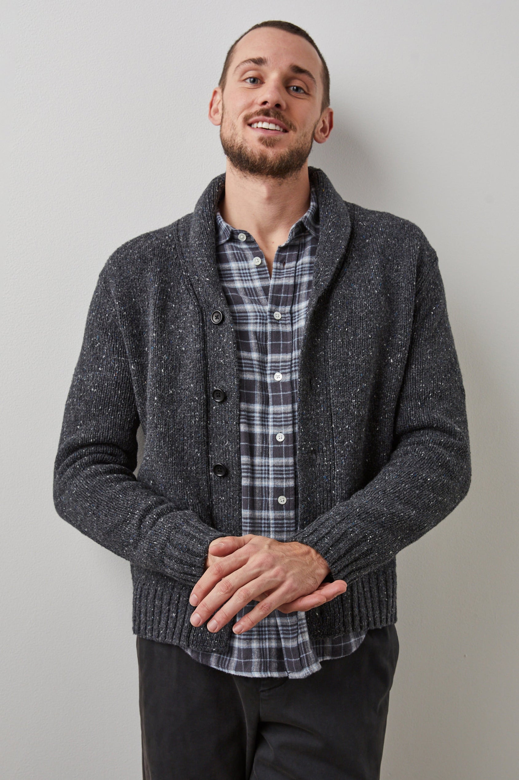 Corden Long-Sleeve Cardigan with Button Closure, a Shawl Collar and Ribbed Trim in Constellation Colorway, White and Blue Speckles on Dark Grey - Front View Featured on Model