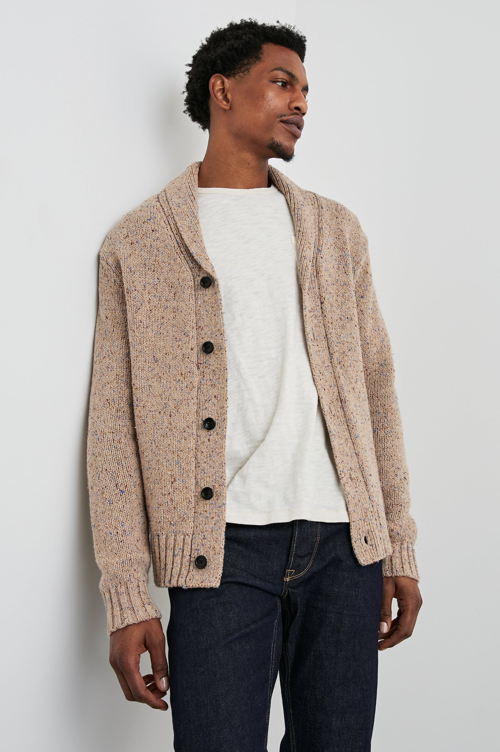 Corden Long-Sleeve Cardigan with Button Closure, a Shawl Collar and Ribbed Trim in Oatmeal Speckle Colorway - Front View Featured on Model