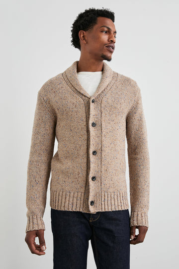 Corden Long-Sleeve Cardigan with Button Closure, a Shawl Collar and Ribbed Trim in Oatmeal Speckle Colorway - Front View Featured on Model