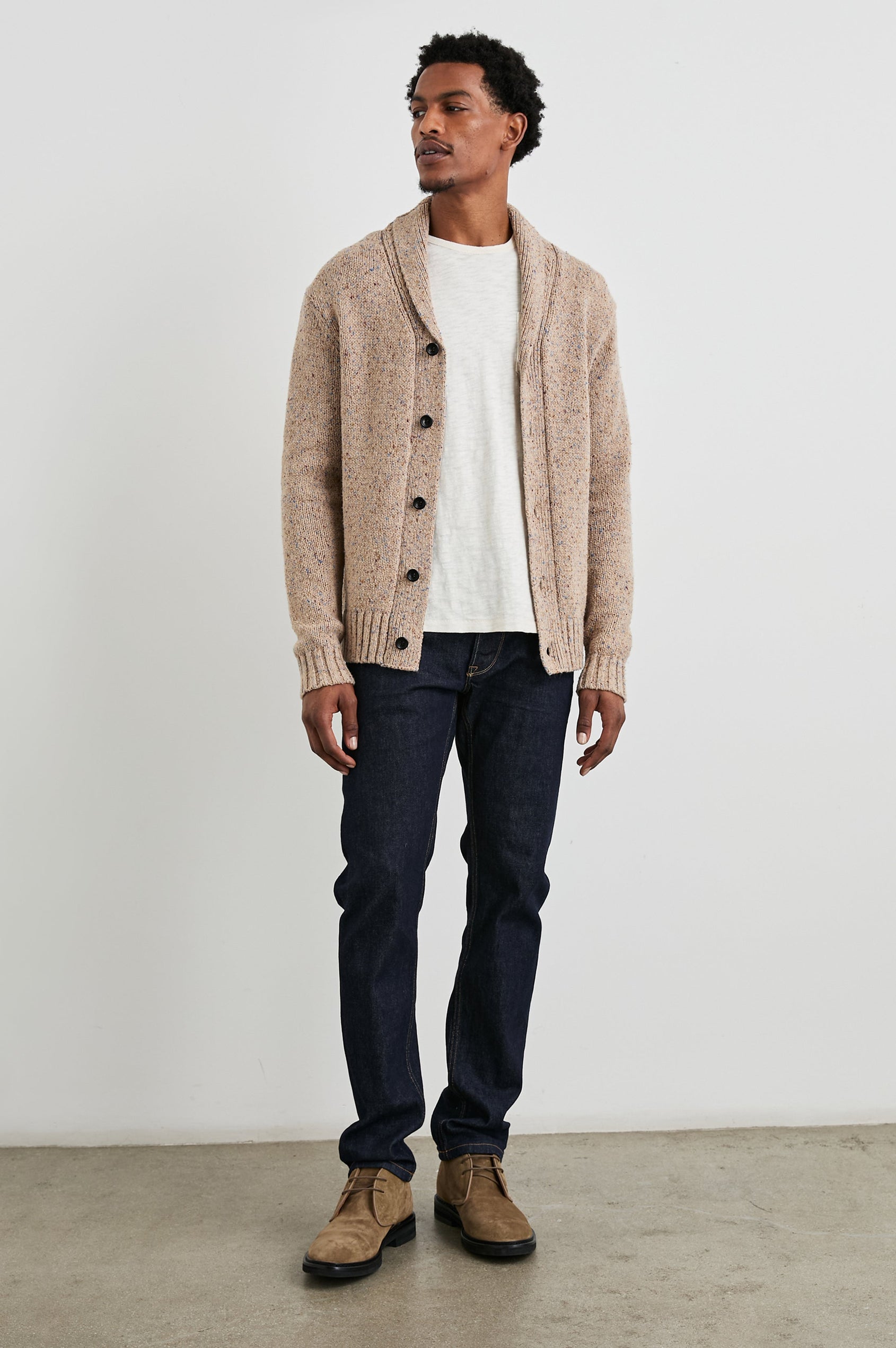 Corden Long-Sleeve Cardigan with Button Closure, a Shawl Collar and Ribbed Trim in Oatmeal Speckle Colorway - Front Full Body View Featured on Model
