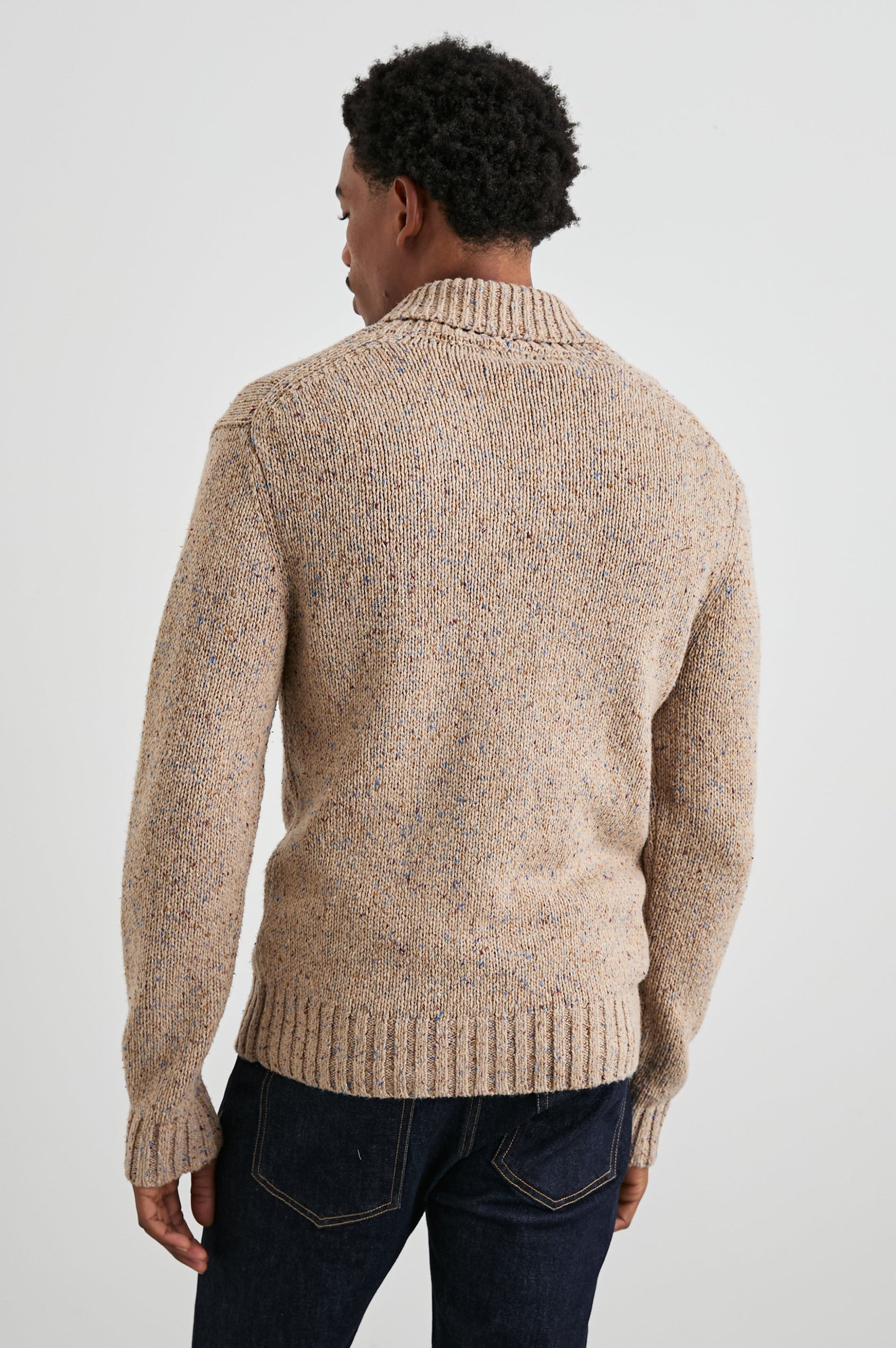 Corden Long-Sleeve Cardigan with Button Closure, a Shawl Collar and Ribbed Trim in Oatmeal Speckle Colorway - Back View Featured on Model
