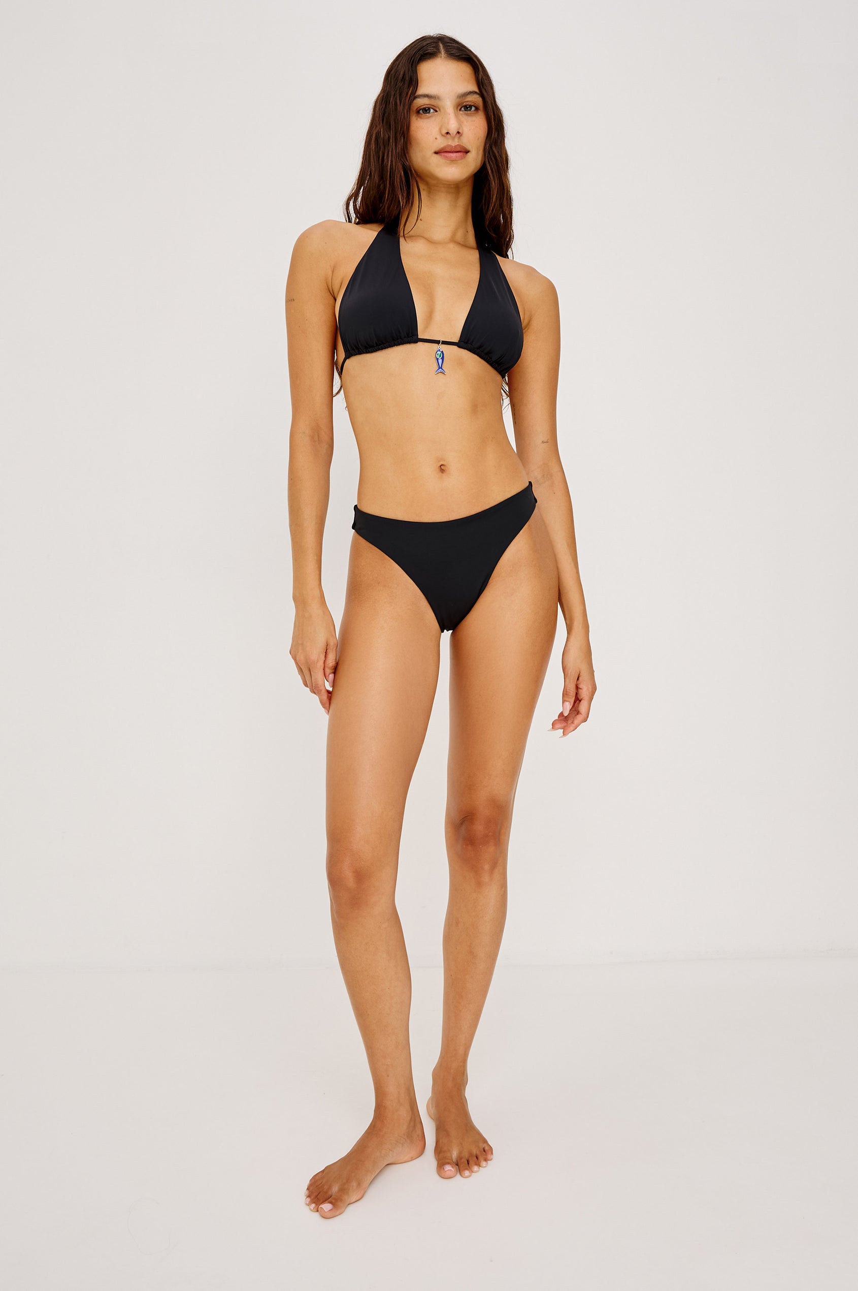 Corsica Bikini Bottom With Fixed Side Straps and Cheeky Rear Coverage in Black Colorway - Full Body Front View Featured on Model