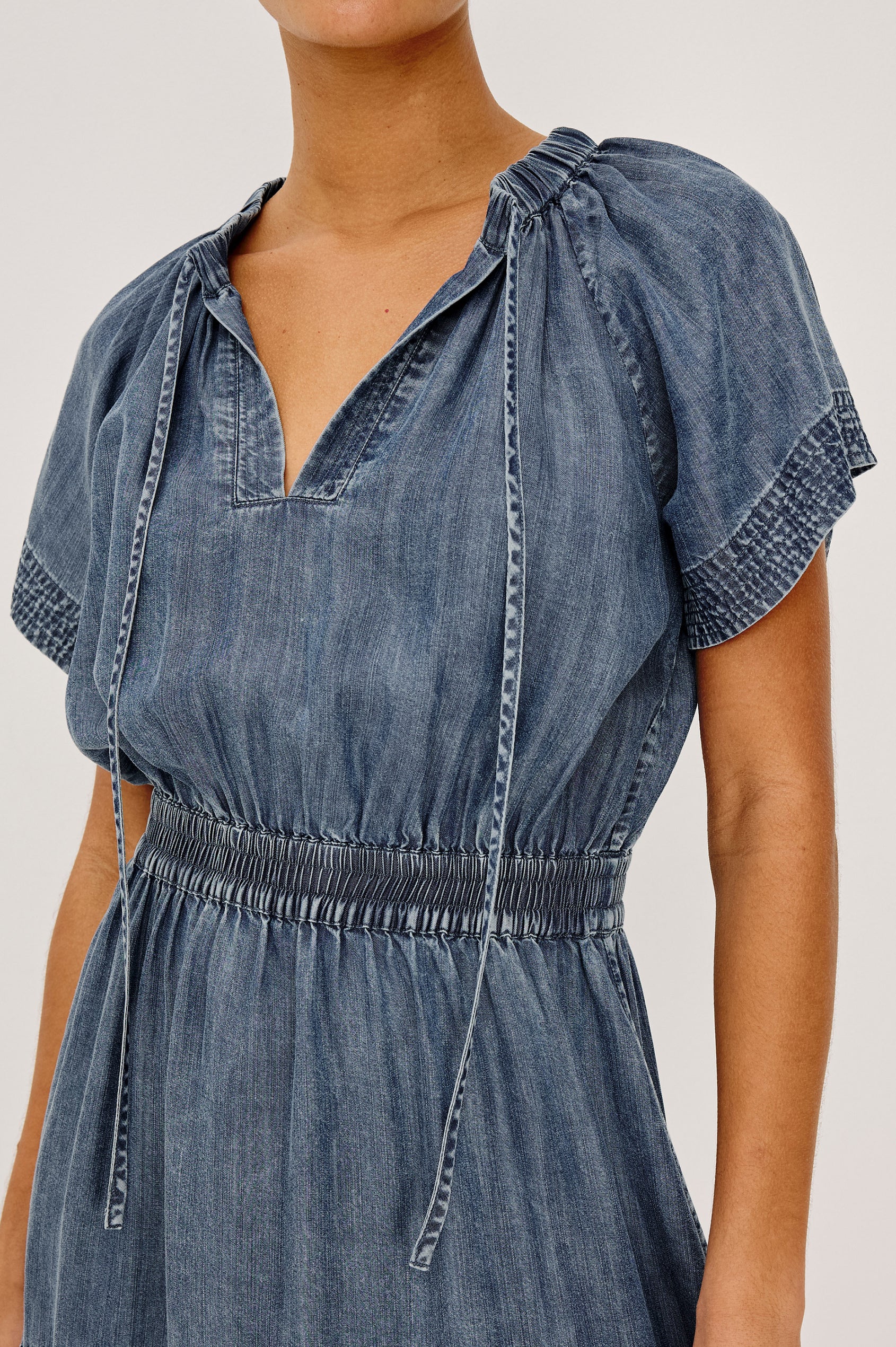 Corvera Mini Dress in TENCEL™ With Split V-Neckline, Short Raglan Flutter Sleeves, Elastic Waist, Tiered Skirt, and Loose, Relaxed Fit in Blue Ridge Colorway - Upper Body Front View Featured on Model