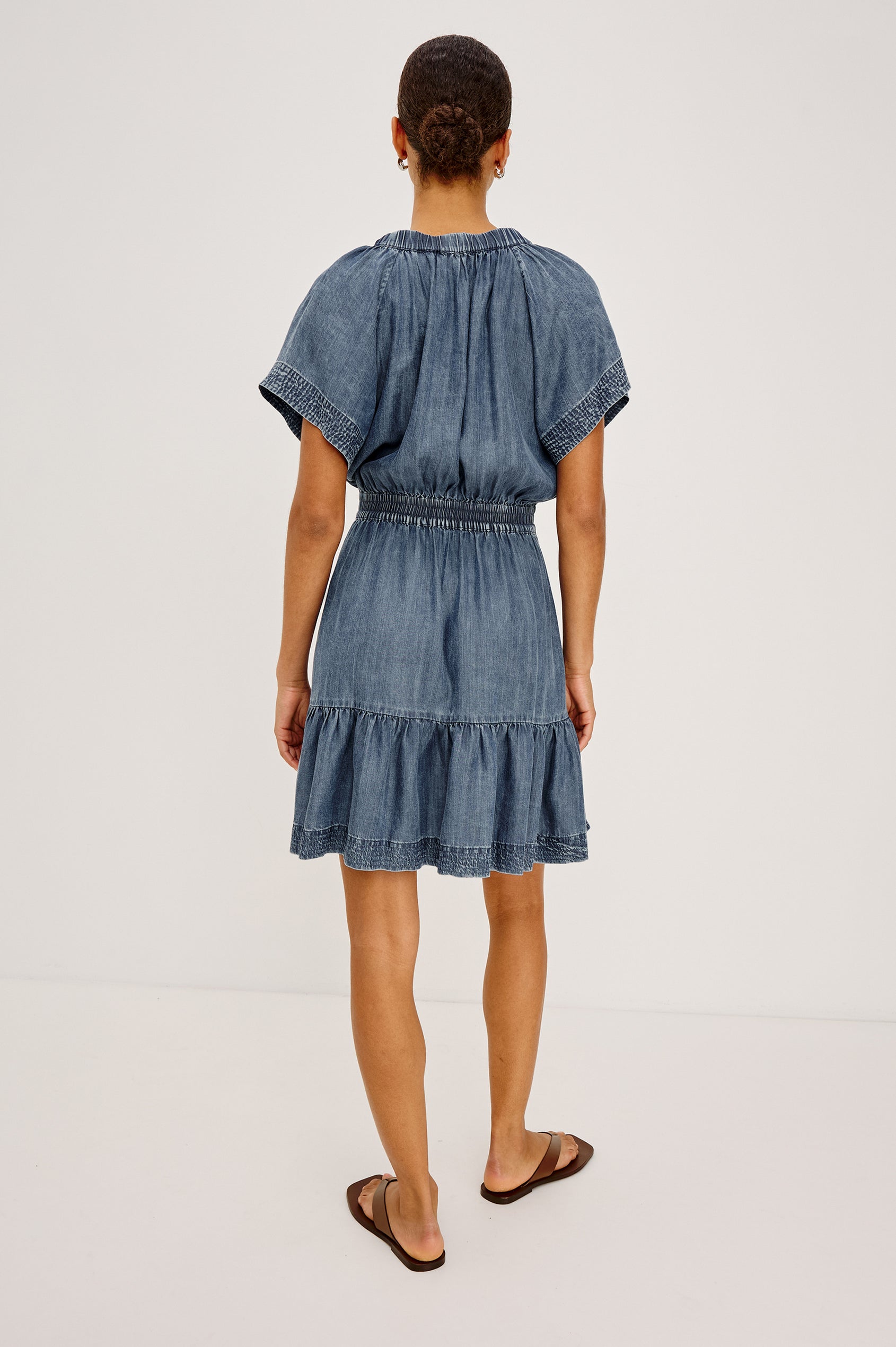 Corvera Mini Dress in TENCEL™ With Split V-Neckline, Short Raglan Flutter Sleeves, Elastic Waist, Tiered Skirt, and Loose, Relaxed Fit in Blue Ridge Colorway - Upper Body Back View Featured on Model