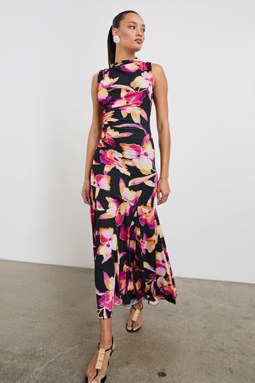 Cosmos Maxi-Length Dress with a Cowl Neck, Sleeveless, Form Fitting with a Ruched Side Seam Detail and an A-line Hem in Dusk Orchid Colorway. Full Length Front View Shown on Model.