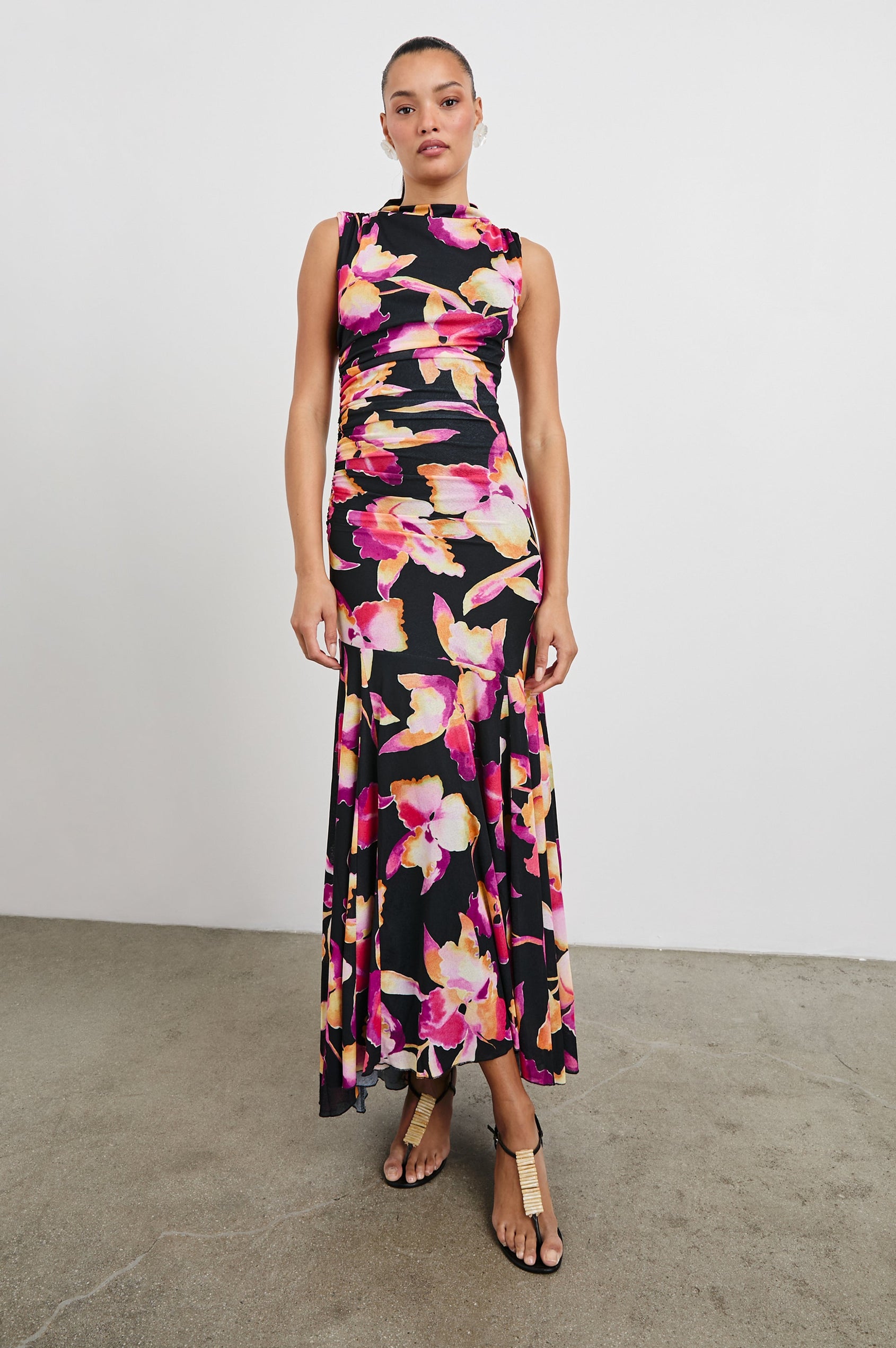 Cosmos Maxi-Length Dress with a Cowl Neck, Sleeveless, Form Fitting with a Ruched Side Seam Detail and an A-line Hem in Dusk Orchid Colorway. Full Length Front View Shown on Model.