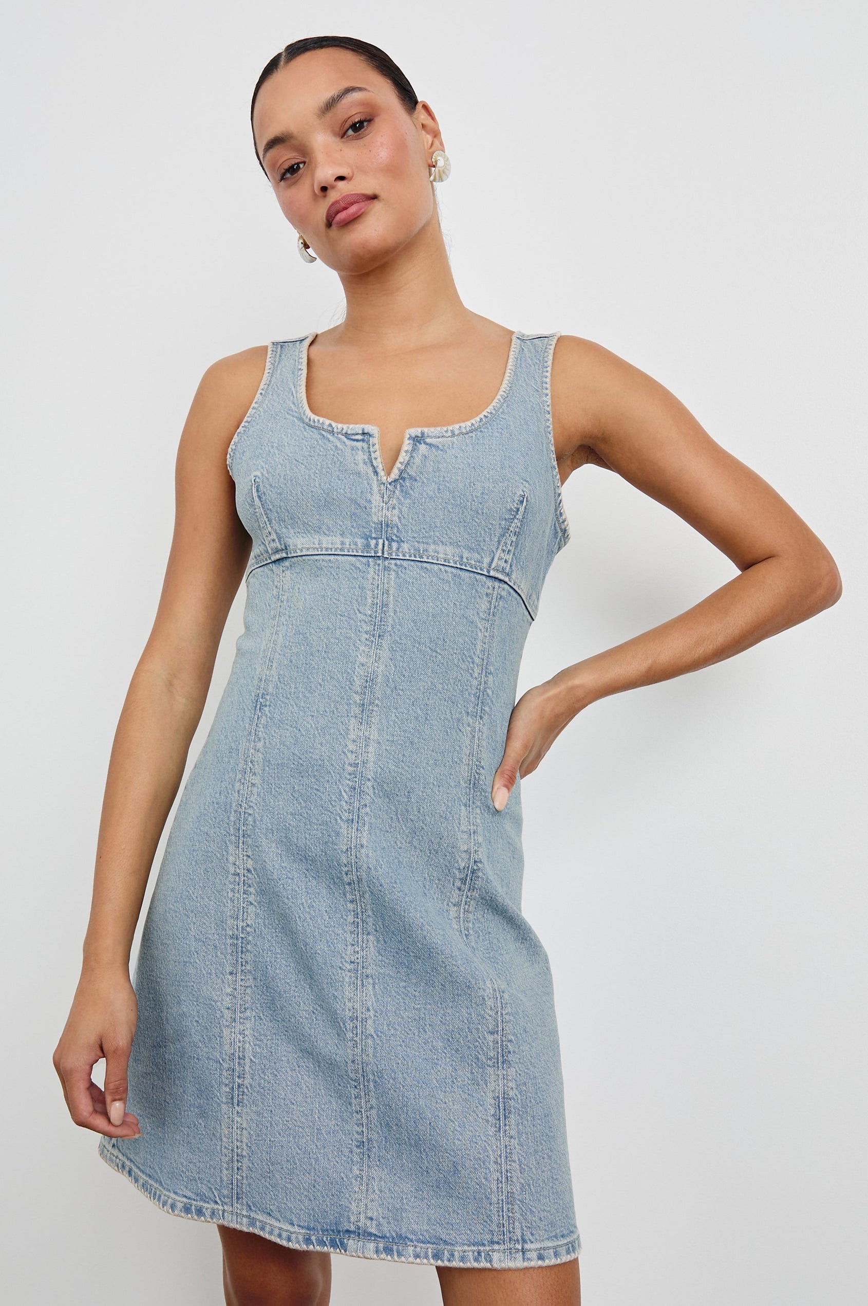 Cove Denim Tank Dress with a Scoop Split neck, Empire Bust, A-line and Above-Knee Length in Capri Colorway.  Front View Shown on Model.