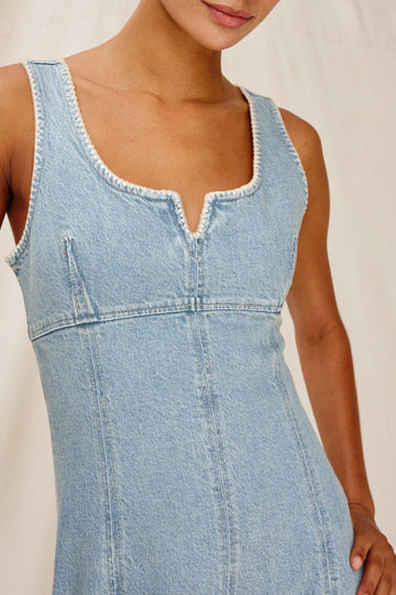 Cove Denim Tank Dress with a Scoop Split neck, Empire Bust, A-line and Above-Knee Length in Capri Colorway. Front Detailed View Shown on Model.