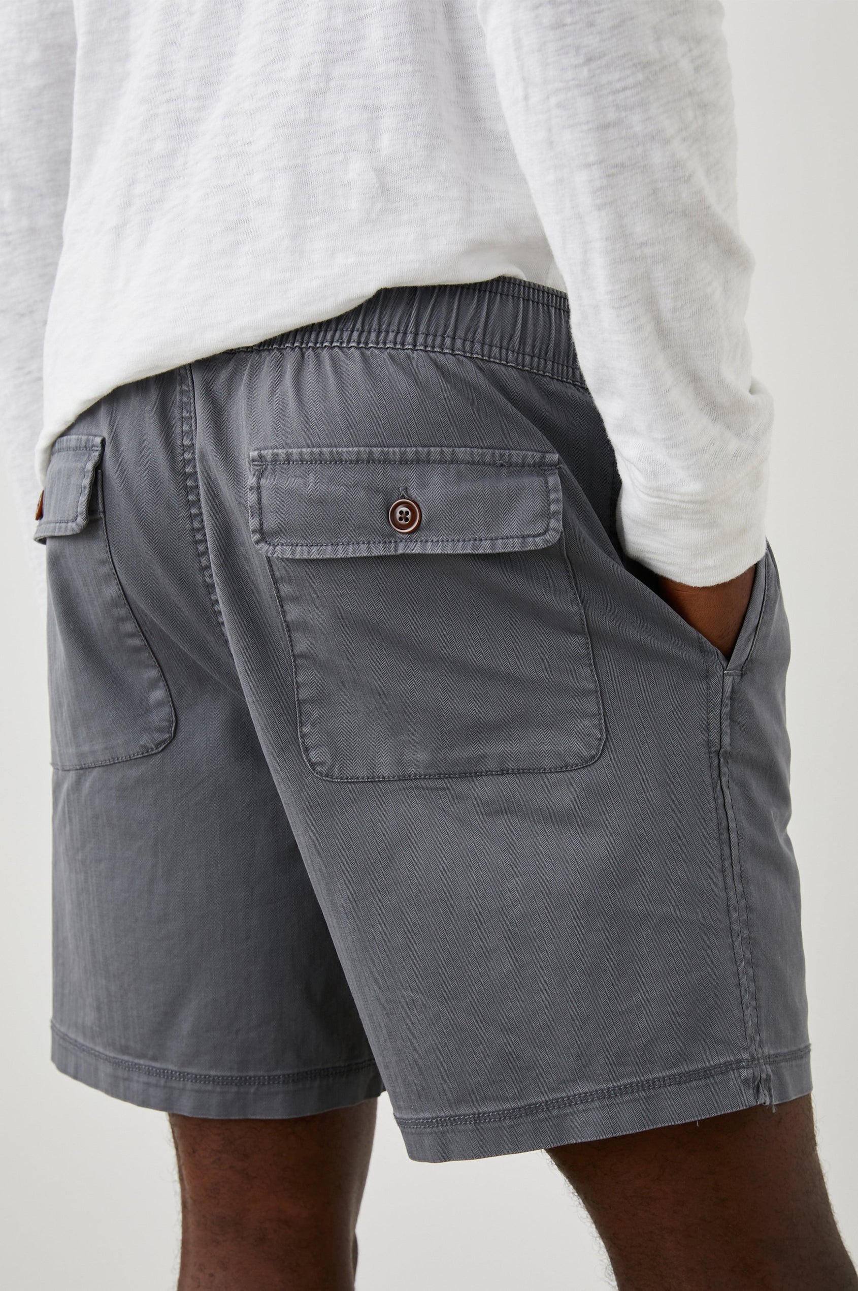 Cruz Shorts with a Drawstring Waist, Two Front Pockets, Two Back Button Flap Pockets in Charcoal Colorway - Back View Featured on Model 