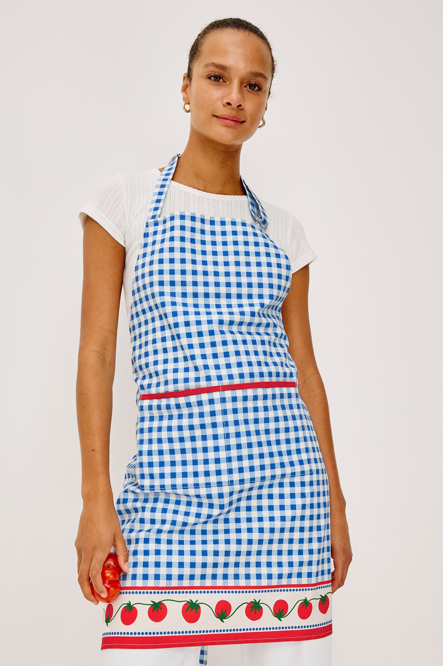 Cucina Apron in Cotton With Adjustable Halter Strap and Adjustable Back Ties in Gingham Tomatoes Colorway - Upper Body Front View Featured on Model