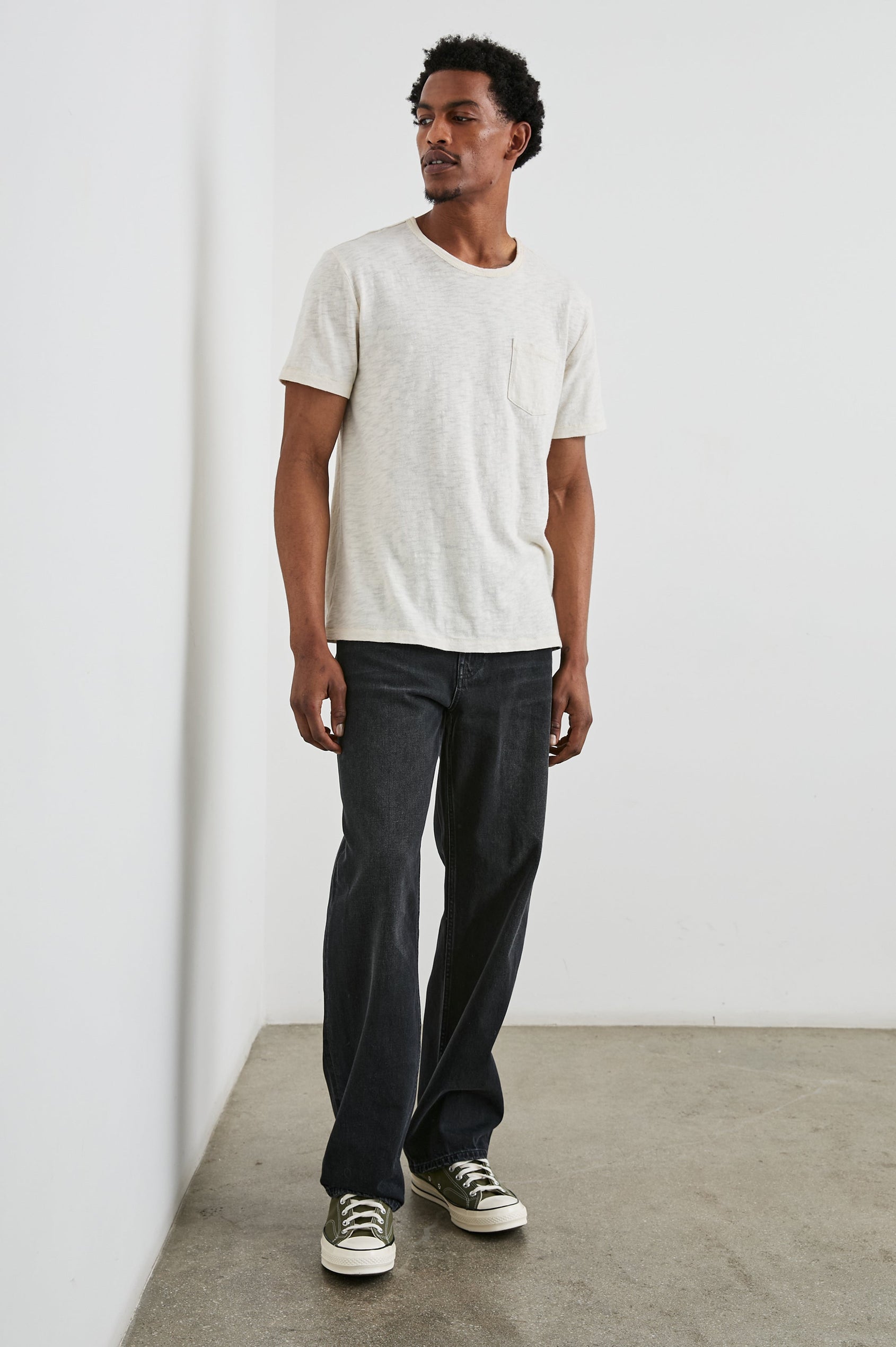 Cutler 90's Loose Jeans with Belt Loops, Two Front Pockets plus a Coin Pocket and Two Back Patch Pockets in Distressed Black Colorway - Front Full Body View Featured on Model