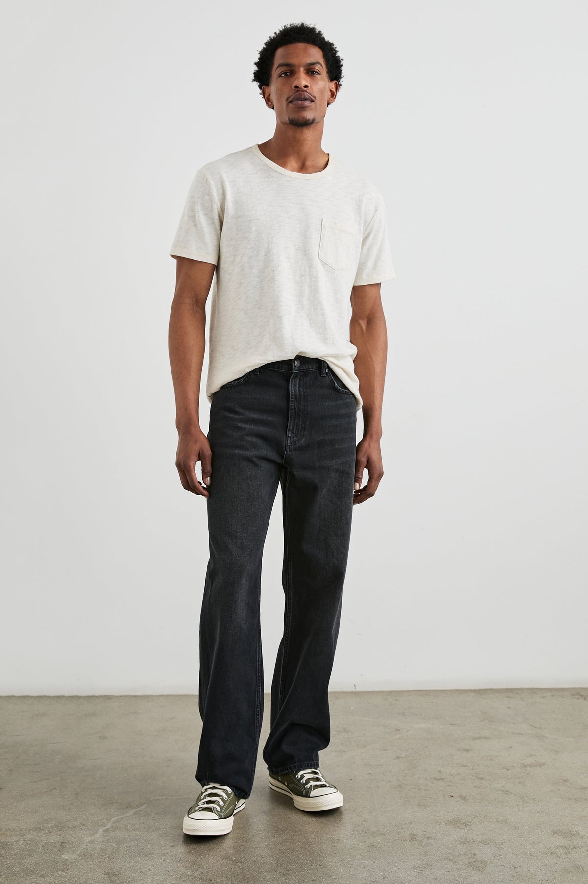 Cutler 90's Loose Jeans with Belt Loops, Two Front Pockets plus a Coin Pocket and Two Back Patch Pockets in Distressed Black Colorway - Full Body Front View Featured on Model