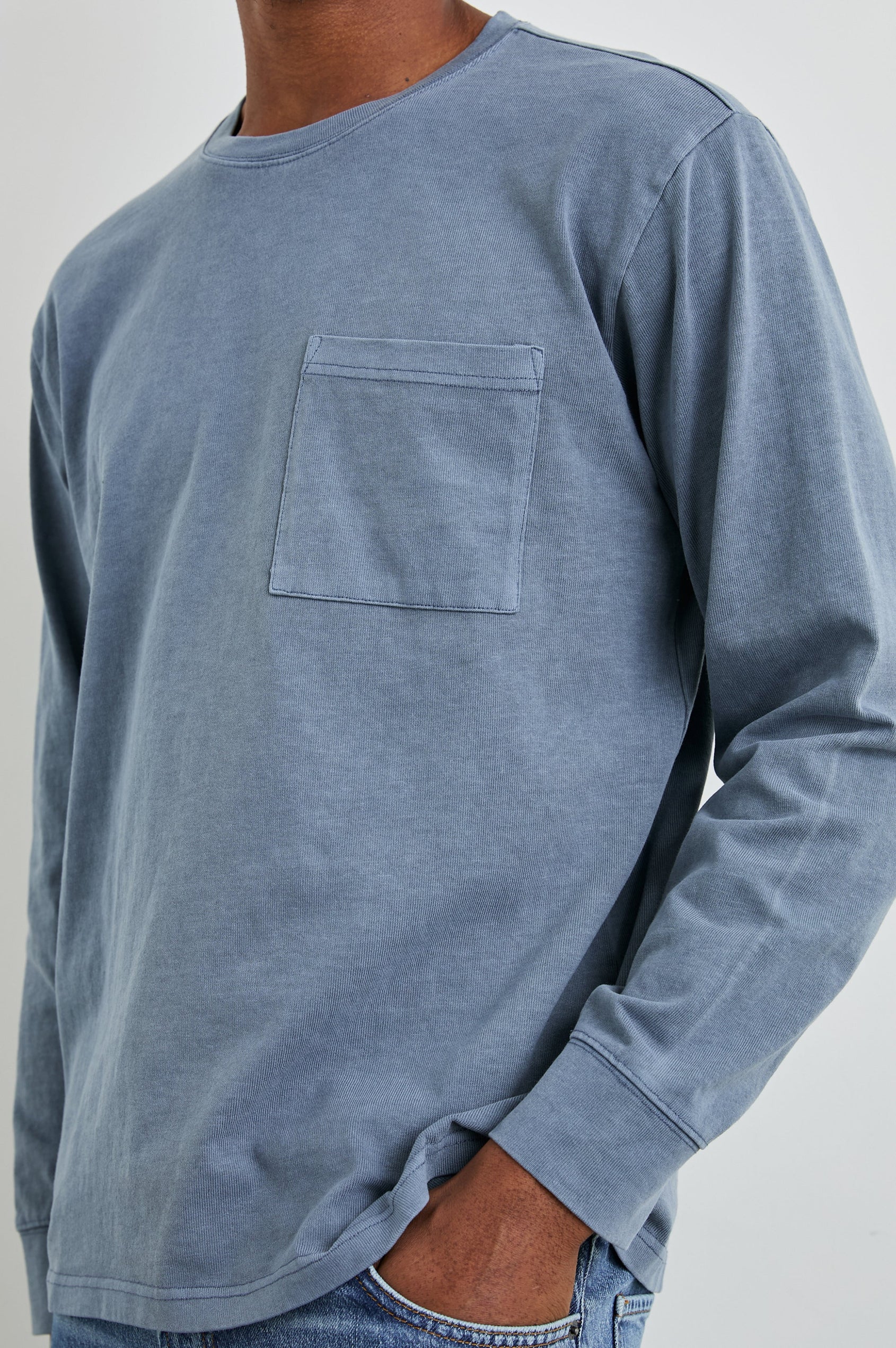 Cyd Long Sleeve Crew Neck T-Shirt  with a Chest Patch Pocket in Steel Colorway - Front View Featured on Model