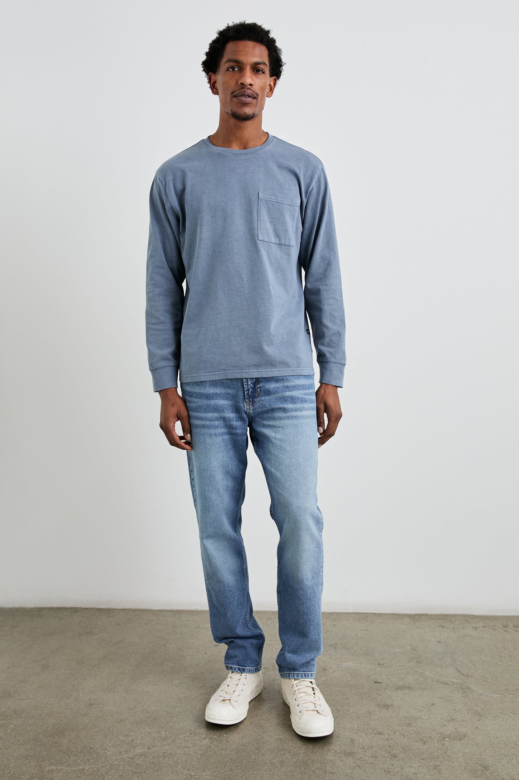 Cyd Long Sleeve Crew Neck T-Shirt  with a Chest Patch Pocket in Steel Colorway - Front Full Body View Featured on Model
