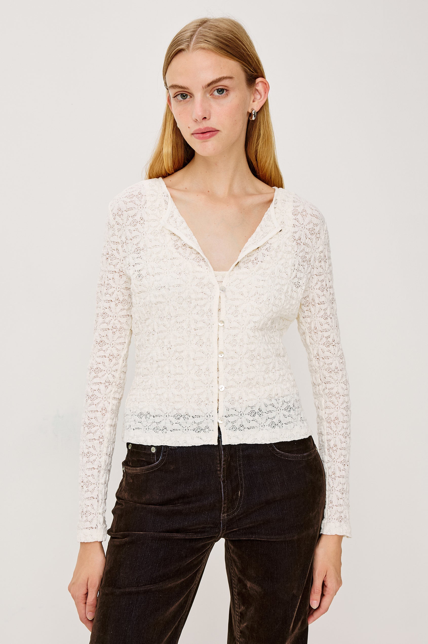 Cyrah Cardigan in Sheer Stretch Lace With Fitted Long Sleeves, and Front Button-and-Loop Closures in Ivory Colorway - Upper Body Front View Featured on Model