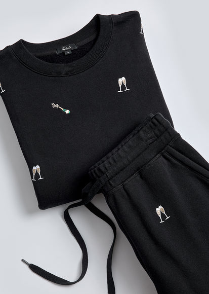 VARSITY SWEATSHIRT AND KINGSTON PANT IN BLACK CHAMPAGNE EMBROIDERY FOLDED TOGETHER