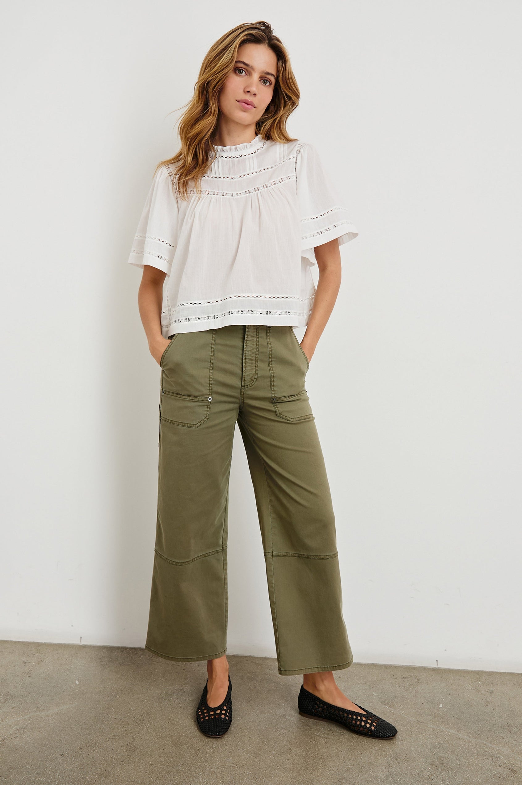 Daisy Short Sleeve Top with Shirred Collar, Trimmed with Cutouts, Keyhole with button in back in White Colorway - Front Full Body View Featured on Model