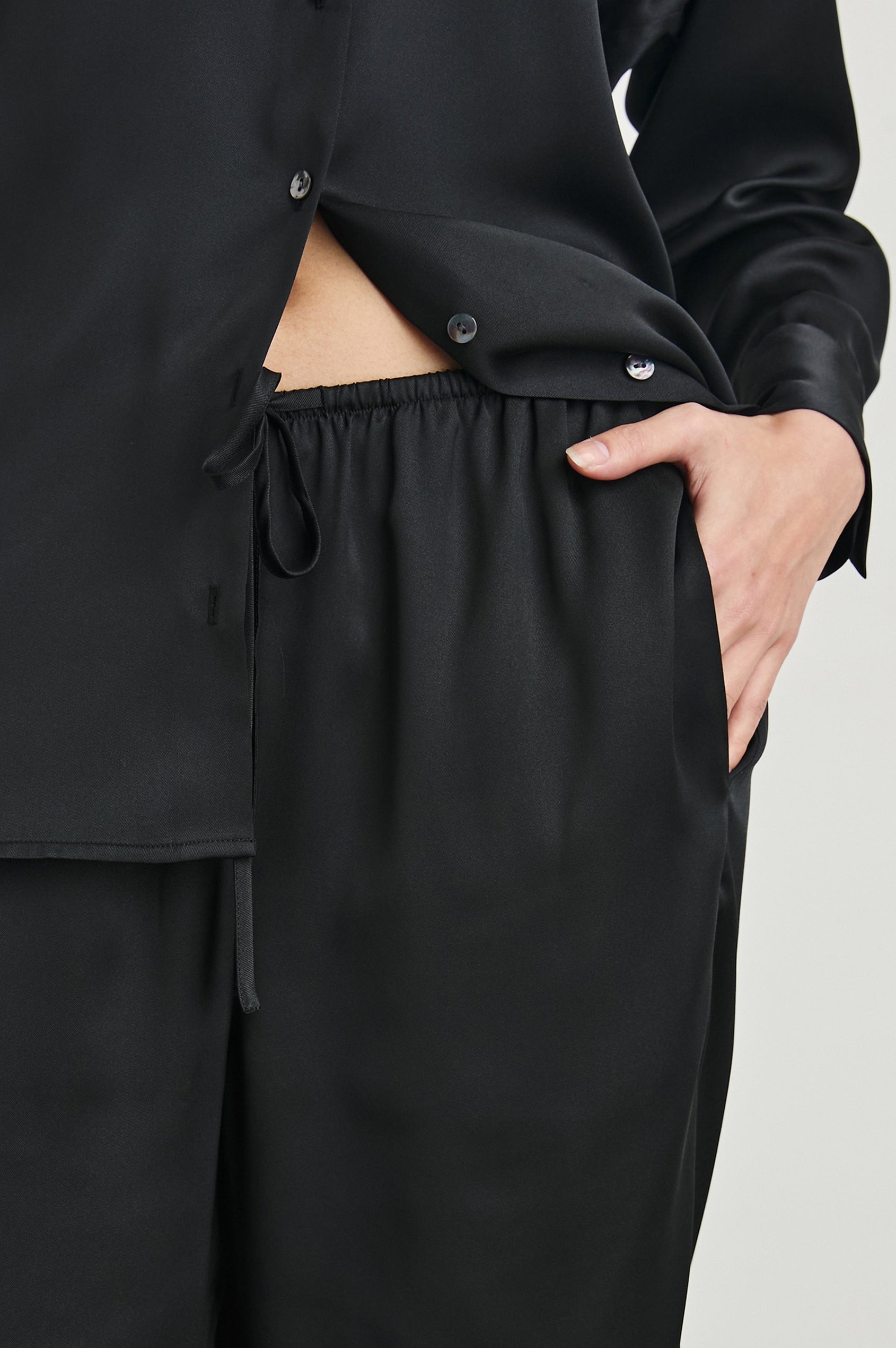 Damini Pants with a Drawstring Waist and Two Front Pockets in Black Colorway - Front View Featured on Model