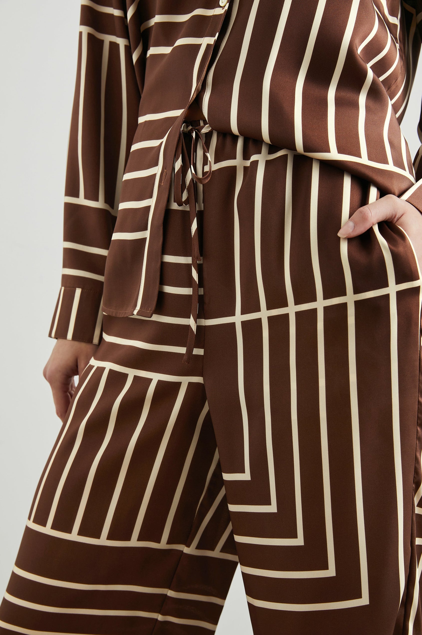 Damini Pants with a Drawstring Waist and Two Front Pockets in Brown Line Art Colorway, white lines on brown - Front View Featured on Model