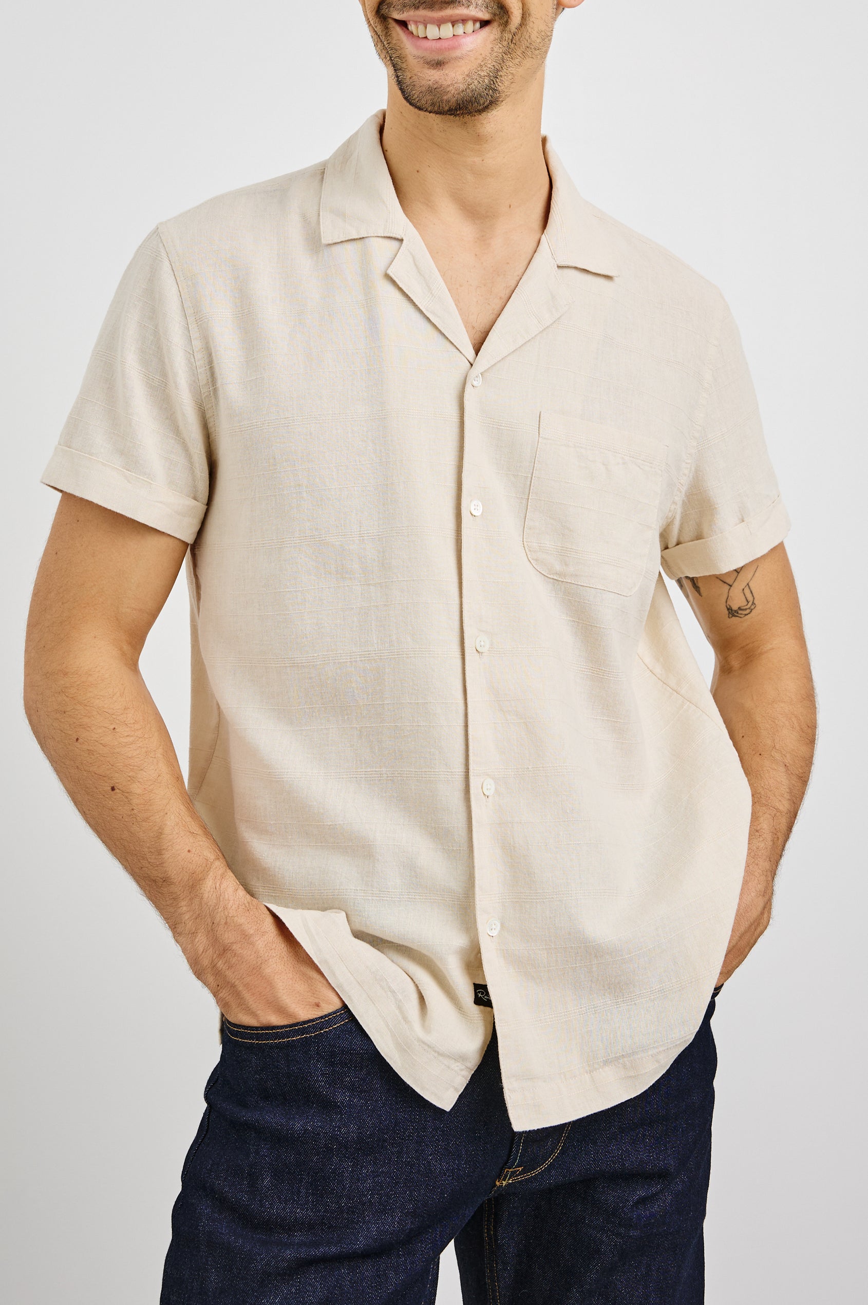 Davis Short Sleeve Button Up with a Chest Patch Pocket, Rolled Cuffs and Textured Horizontal Stripes in Nougat Colorway - Front View Featured on Model