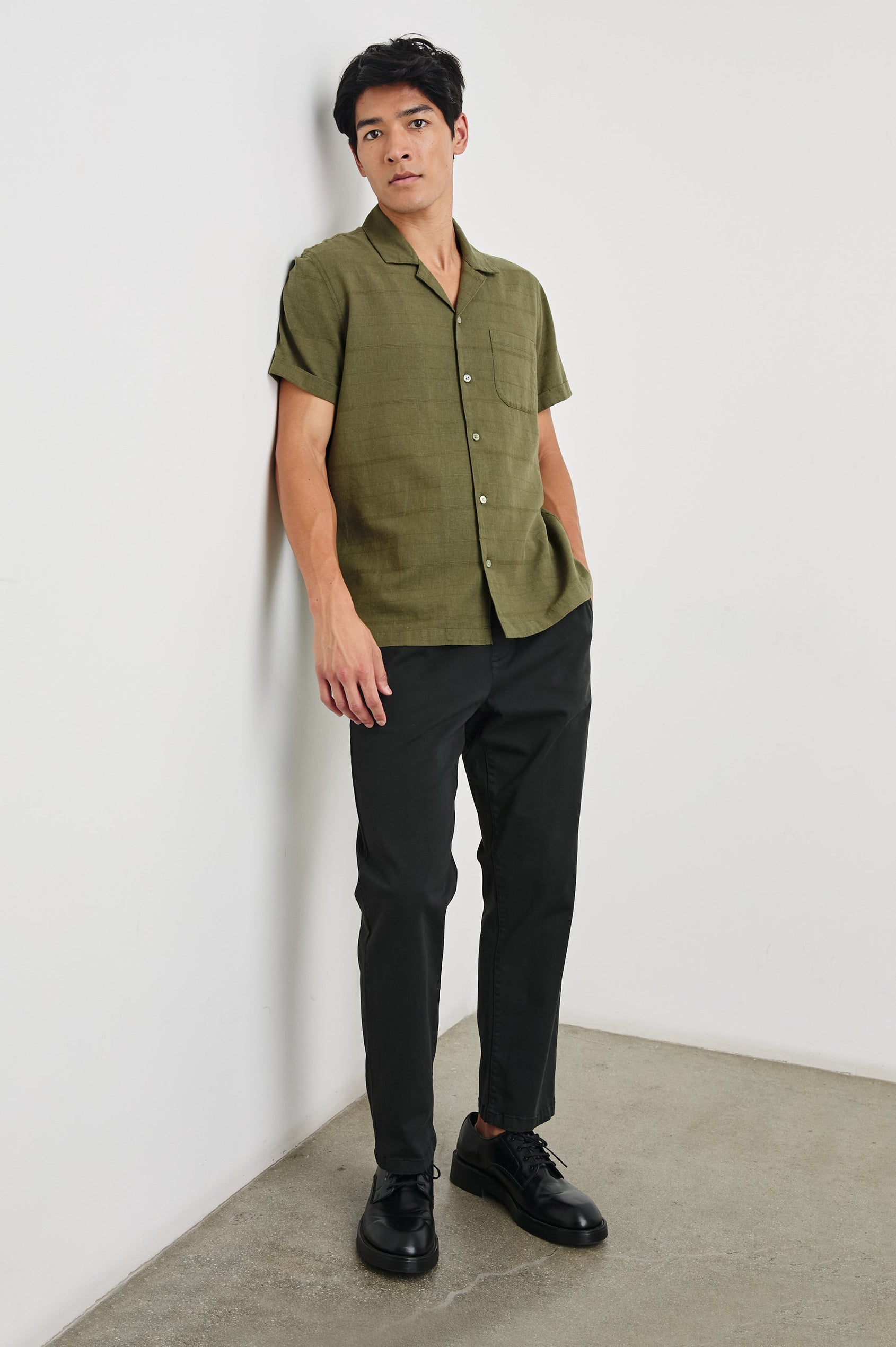 Davis Short Sleeve Button Up with a Chest Patch Pocket, Rolled Cuffs and Textured Horizontal Stripes in True Olive Colorway - Front Full Body View Featured on Model