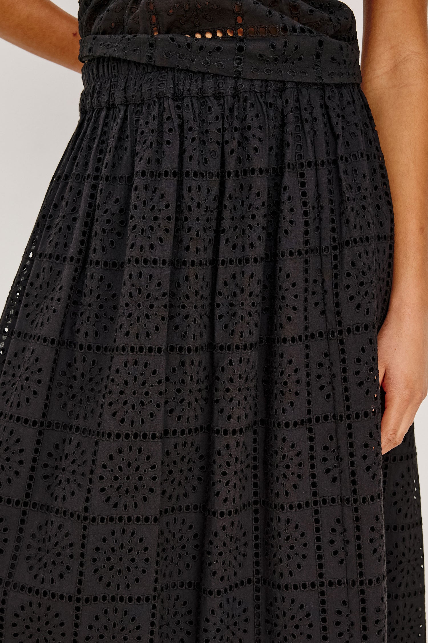 Dax A-Line Maxi Skirt With Grid and Floral Cutwork Embroidery, Elastic Waistband, and is Fully Lined in Black Grid Embroidery Embroidery Colorway - Lower Body Close Up Front View Featured on Model