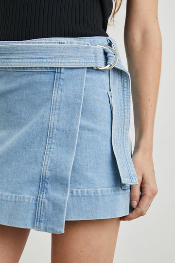 Deanna Mini Wrap Skirt with Fabric Belt and Two Side Pockets in Blue Mist Colorway - Front View Featured on Model