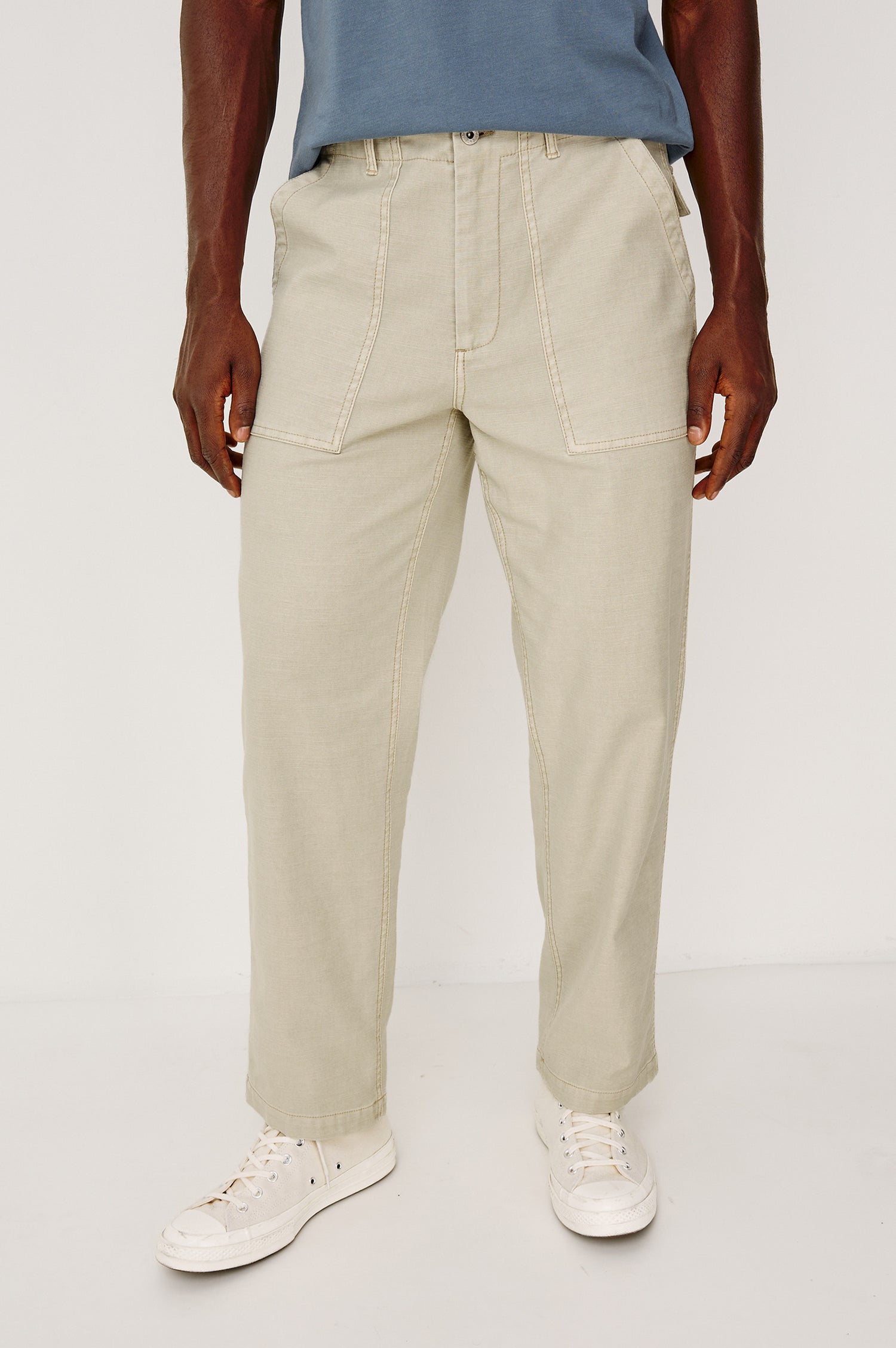 Decker Relaxed Straight Leg Workwear Pant in Stretch Cotton With Lived-In Wash, Zip Fly, and Side and Back Buttoned-Flap Pockets in Natural Colorway - Lower Body Front View Featured on Model