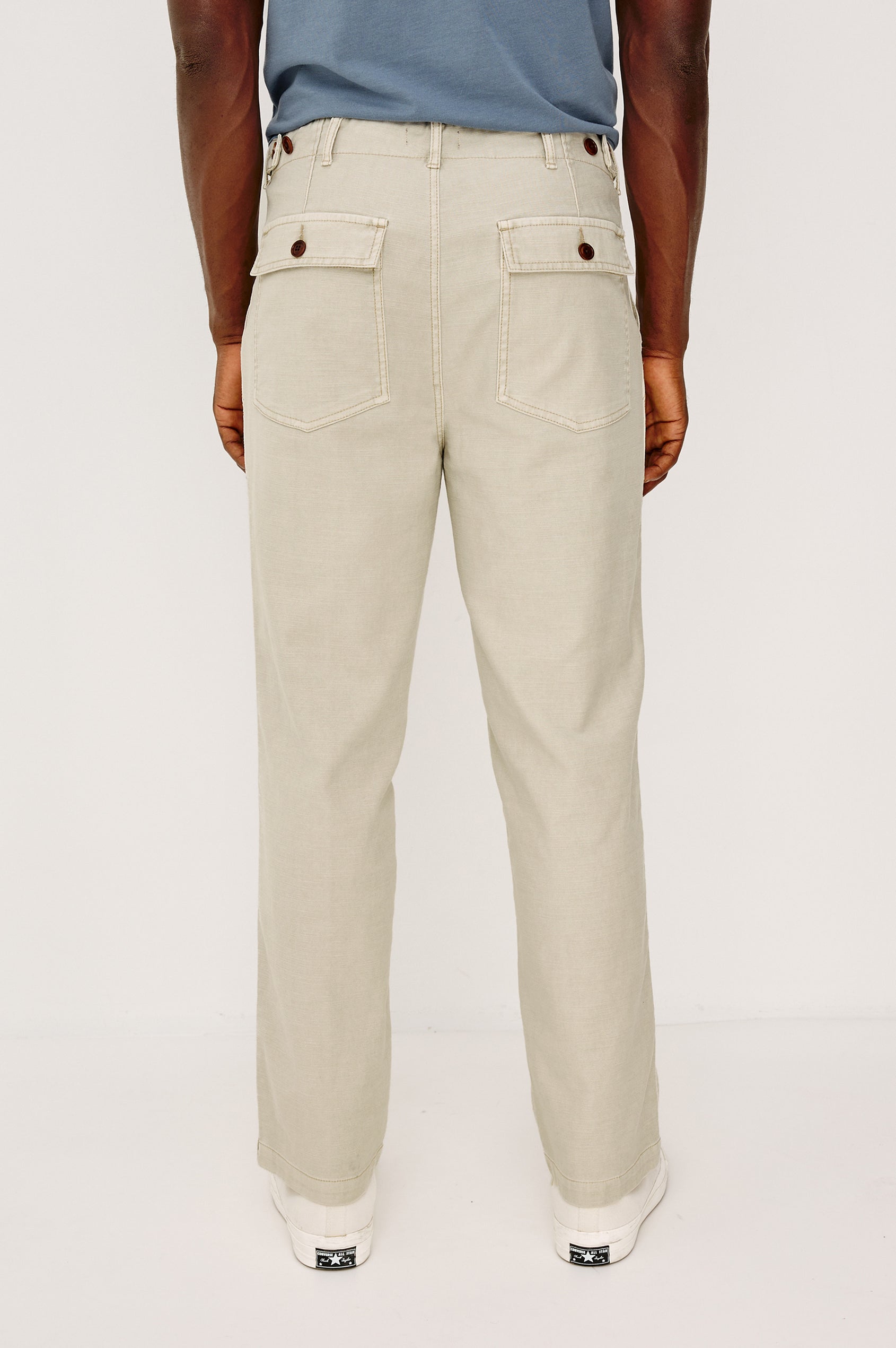 Decker Relaxed Straight Leg Workwear Pant in Stretch Cotton With Lived-In Wash, Zip Fly, and Side and Back Buttoned-Flap Pockets in Natural Colorway - Lower Body Back View Featured on Model