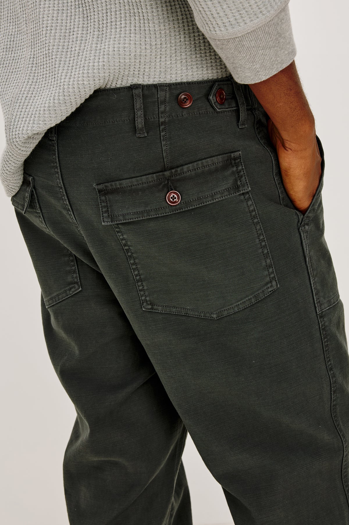 Decker Relaxed Straight Leg Workwear Pant in Stretch Cotton With Lived-In Wash, Zip Fly, and Side and Back Buttoned-Flap Pockets in Washed Black Colorway - Lower Body Close Up Front View Featured on Model