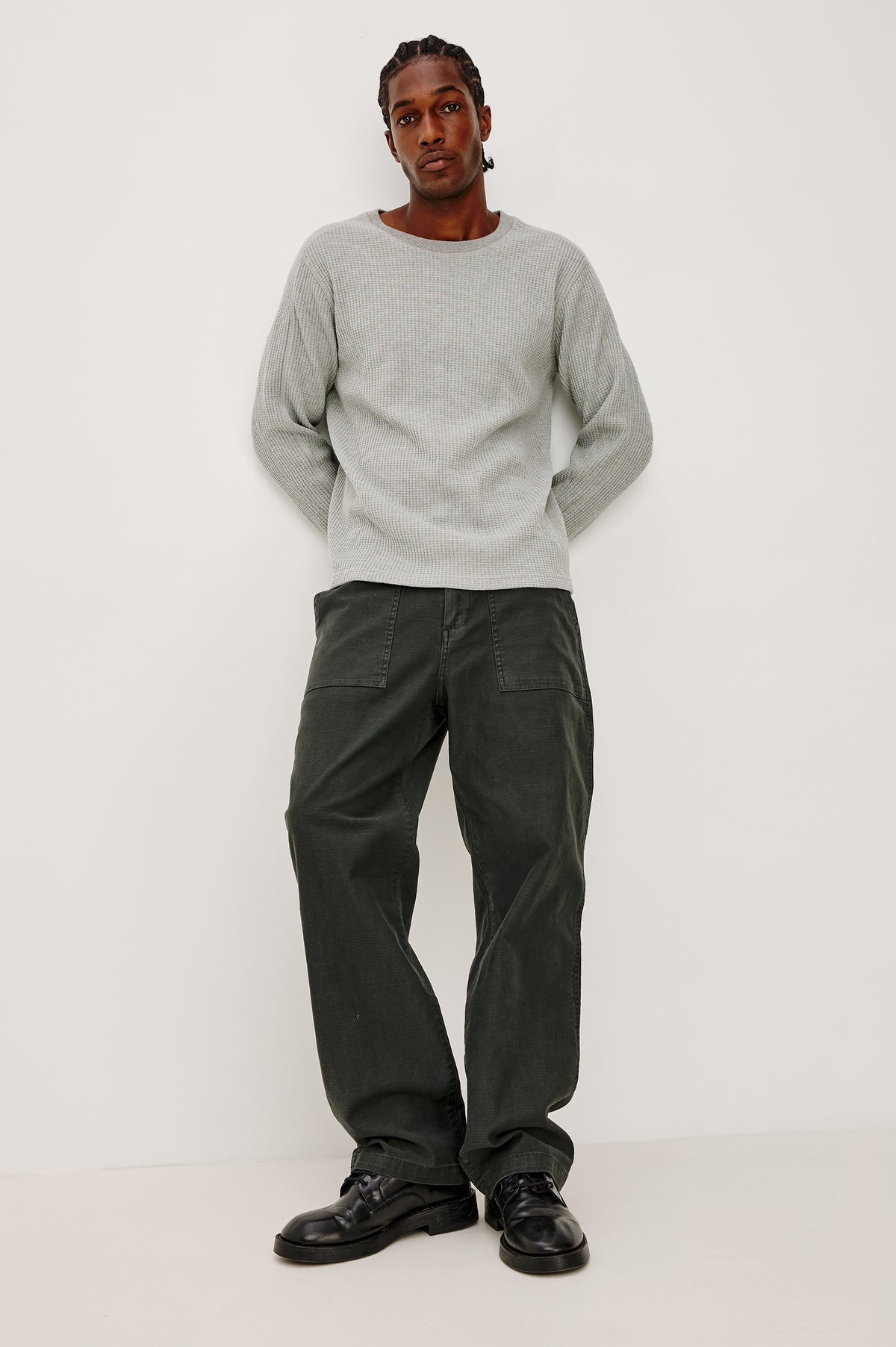 Decker Relaxed Straight Leg Workwear Pant in Stretch Cotton With Lived-In Wash, Zip Fly, and Side and Back Buttoned-Flap Pockets in Washed Black Colorway - Full Body Close Up Front View Featured on Model