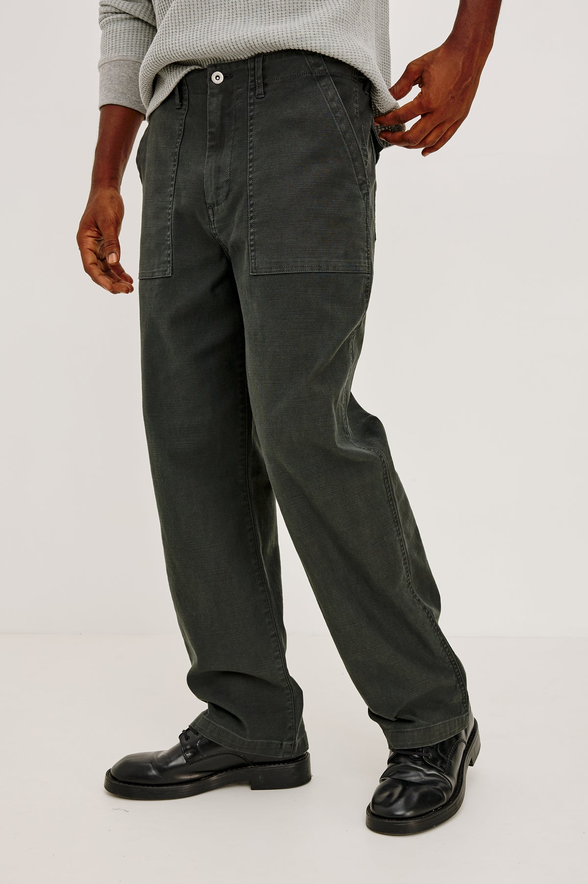 Decker Relaxed Straight Leg Workwear Pant in Stretch Cotton With Lived-In Wash, Zip Fly, and Side and Back Buttoned-Flap Pockets in Washed Black Colorway - Full Body Close Up Front View Featured on Model