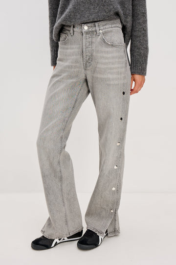 Del Mar low slung baggy boyfriend 5-pocket jean with silver metal studs on side seams and a slit at hem in a grey wash Stone Grey - front view featured on model.